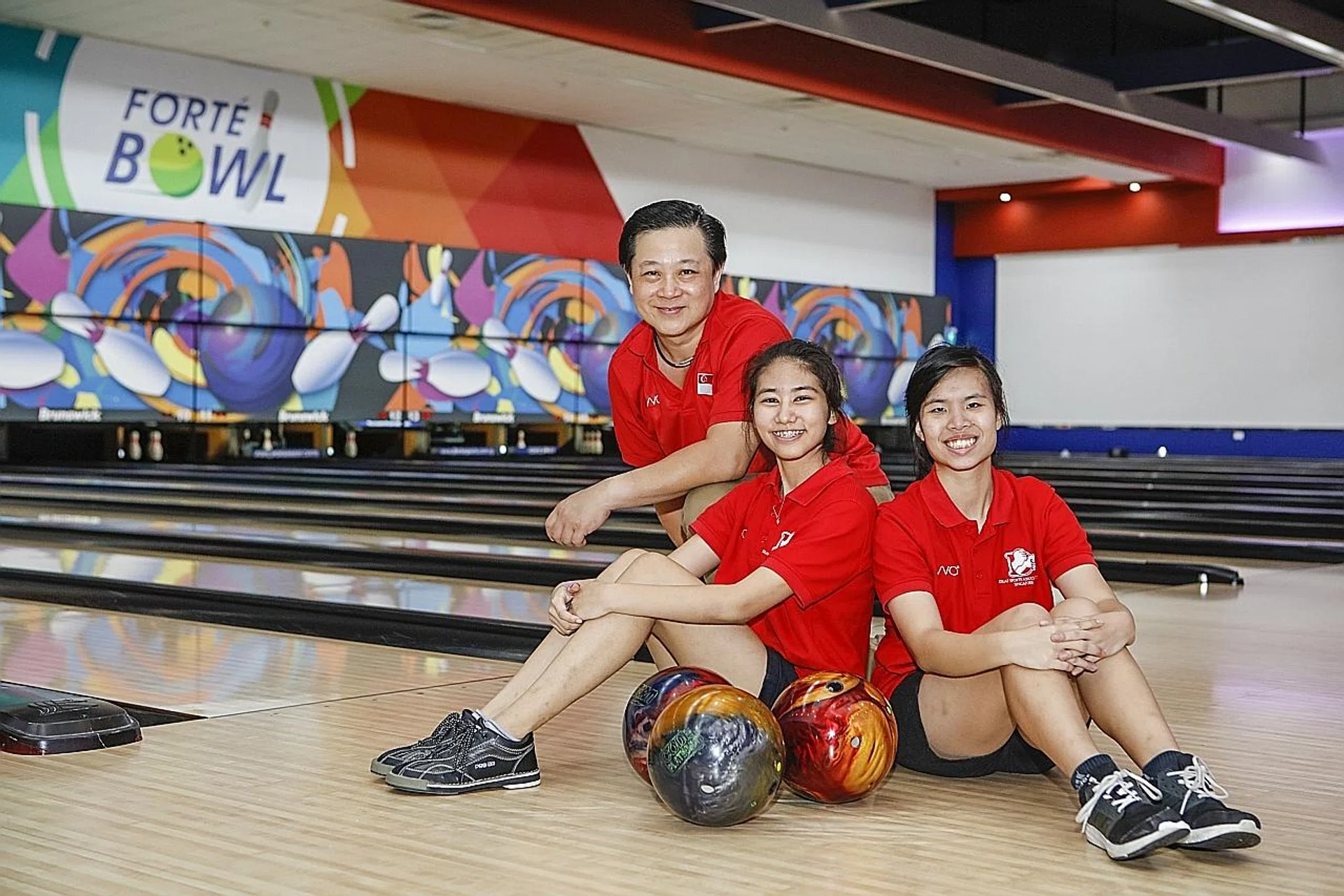 (From left) Vincent Chong, Adelia Naomi Yokoyama and Kimberly Quek won medals at the 1st Asean Deaf Bowling Championships under the guidance of coach Francis Liew. 