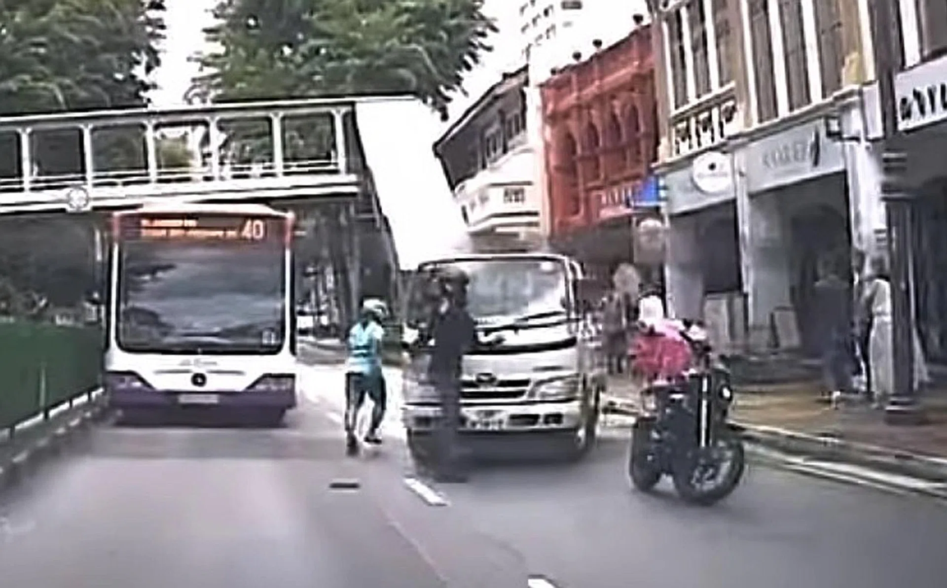 The lorry is seen accelerating towards the bikers, forcing them to move out of its way. 