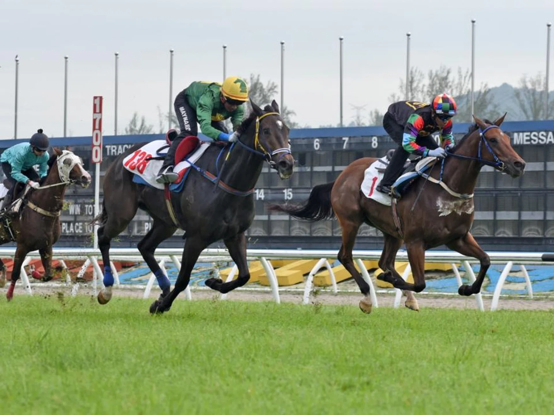Rich N Powerful (Nazir Aiman) finishing the best on the outside to narrowly beat Bold Runner (Ruzaini Supien), on the rails, in barrier trial No. 2 at Sungai Besi on Nov 26.
