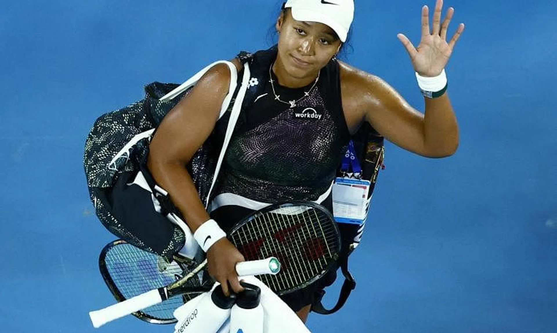 Japan's Naomi Osaka waving to the crowd after losing her Australian Open first-round match against France's Caroline Garcia 6-4, 7-6 (7-2) at Melbourne Park on Jan 15.
