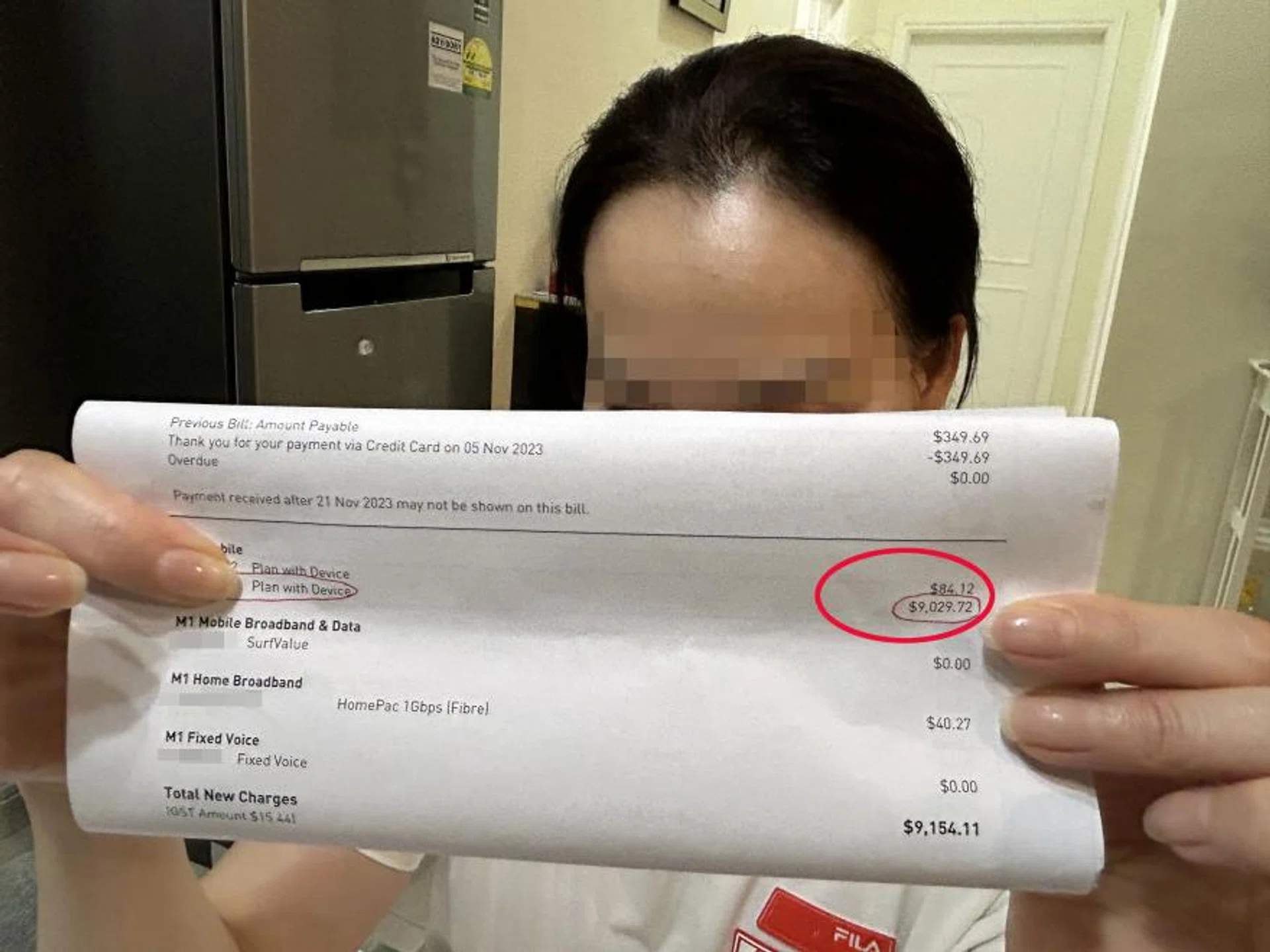 Ms Lin with the phone bill.