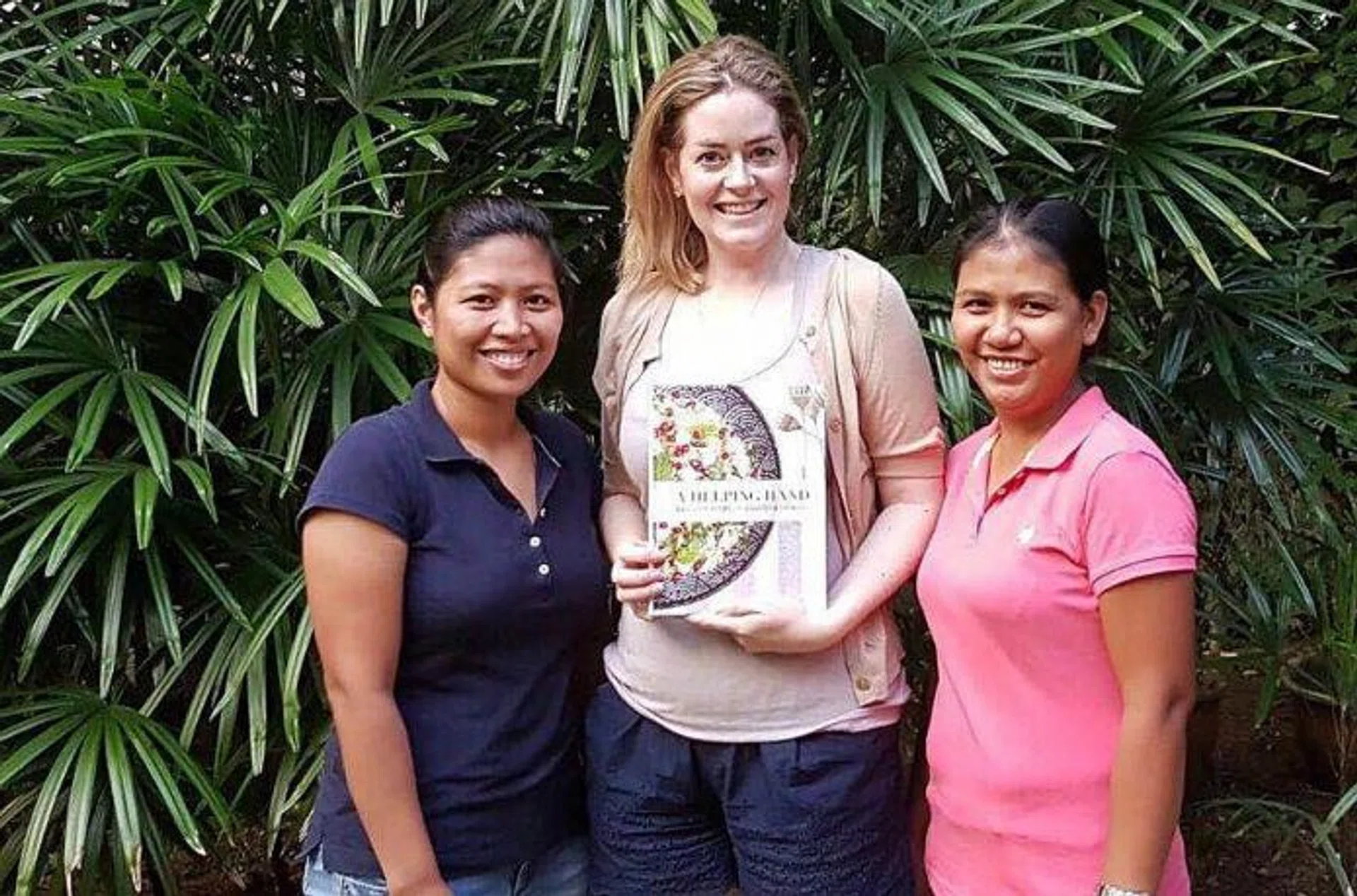 THE WRITE SOLUTION: Author Rowena 'Frog' Michaels with her Filipino maids, Ms Maricon Espiritu (left) and Ms Ginalyn Narag. 