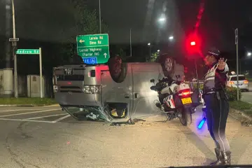 Van overturns after accident with taxi, man arrested for drink driving