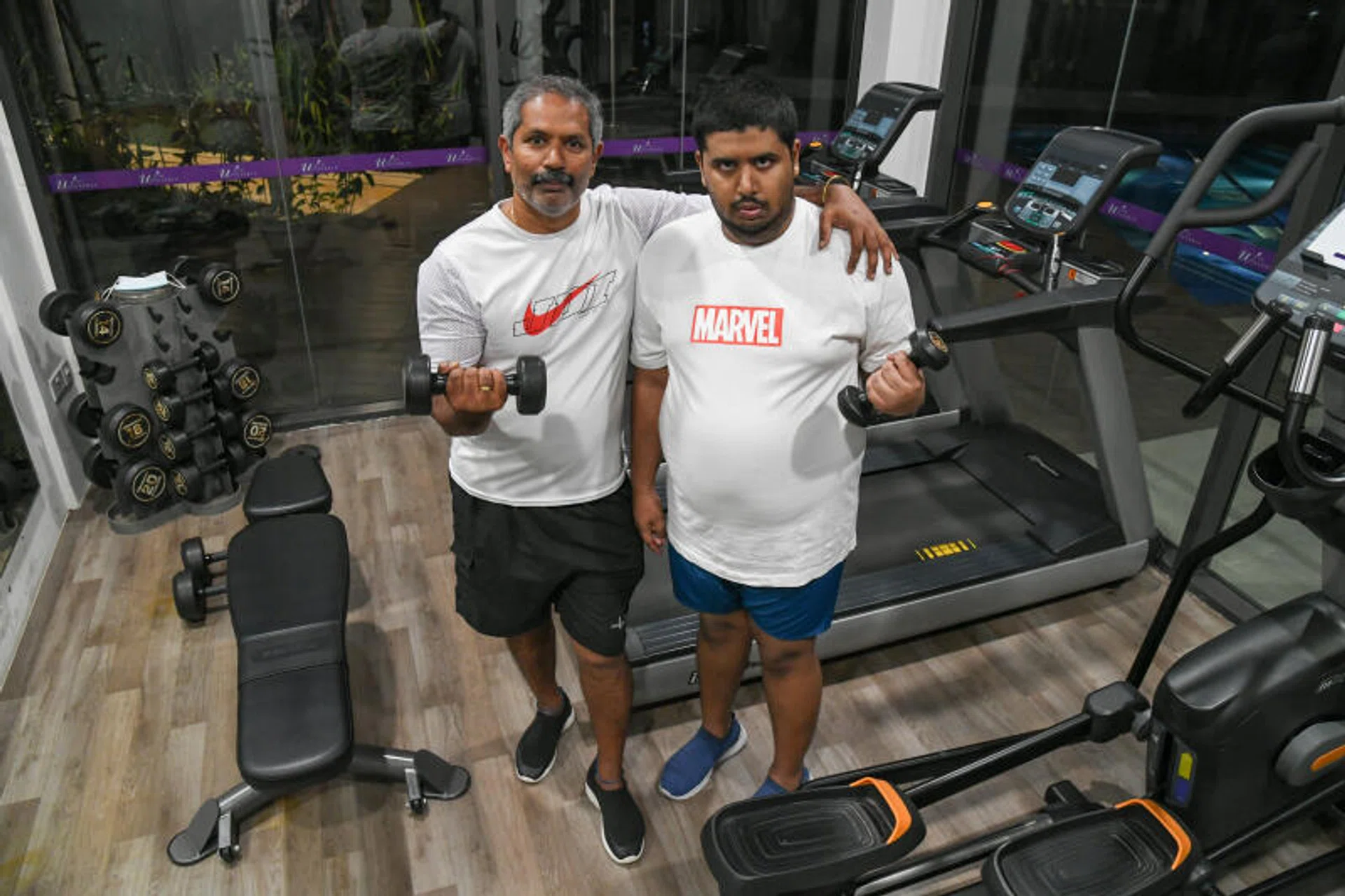 Mr Rajendran K. Sethuraj (left) and his son Kirisnah, who was diagnosed with autism spectrum disorder at three years old. 
