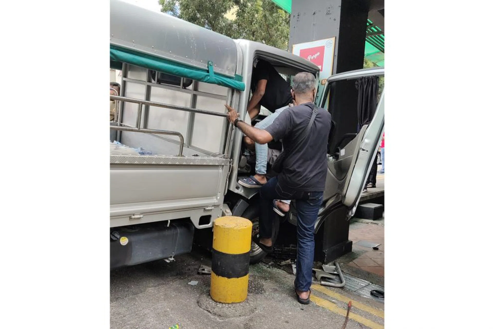 The driver's legs were trapped under the steering wheel as the front of the lorry was badly damaged. 
