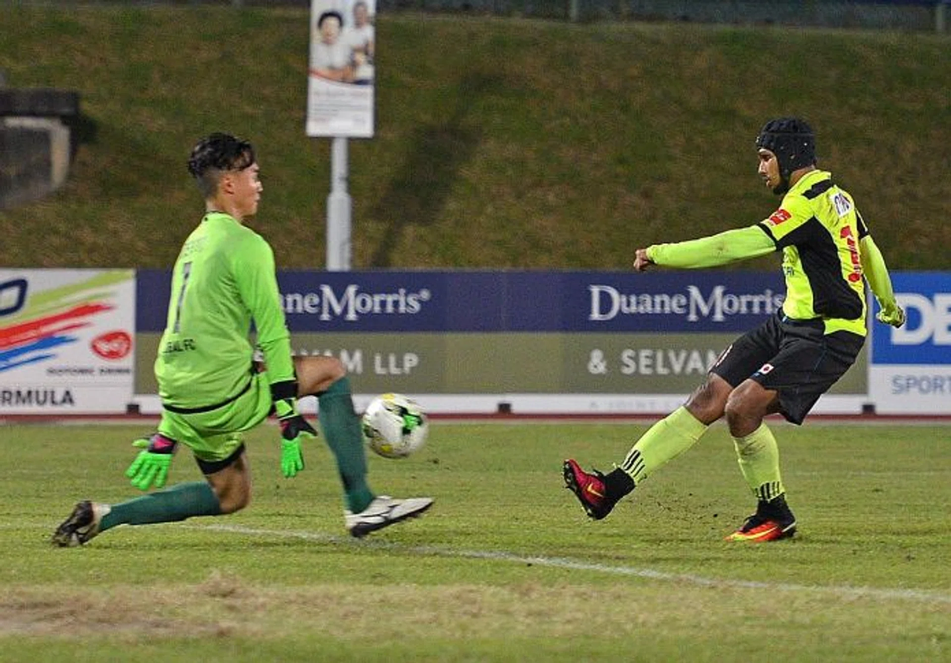 IN-FORM FAZRUL: Tampines Rovers' Fazrul Nawaz (right) restoring their lead by slotting past Global FC's goalkeeper Patrick Deyto.