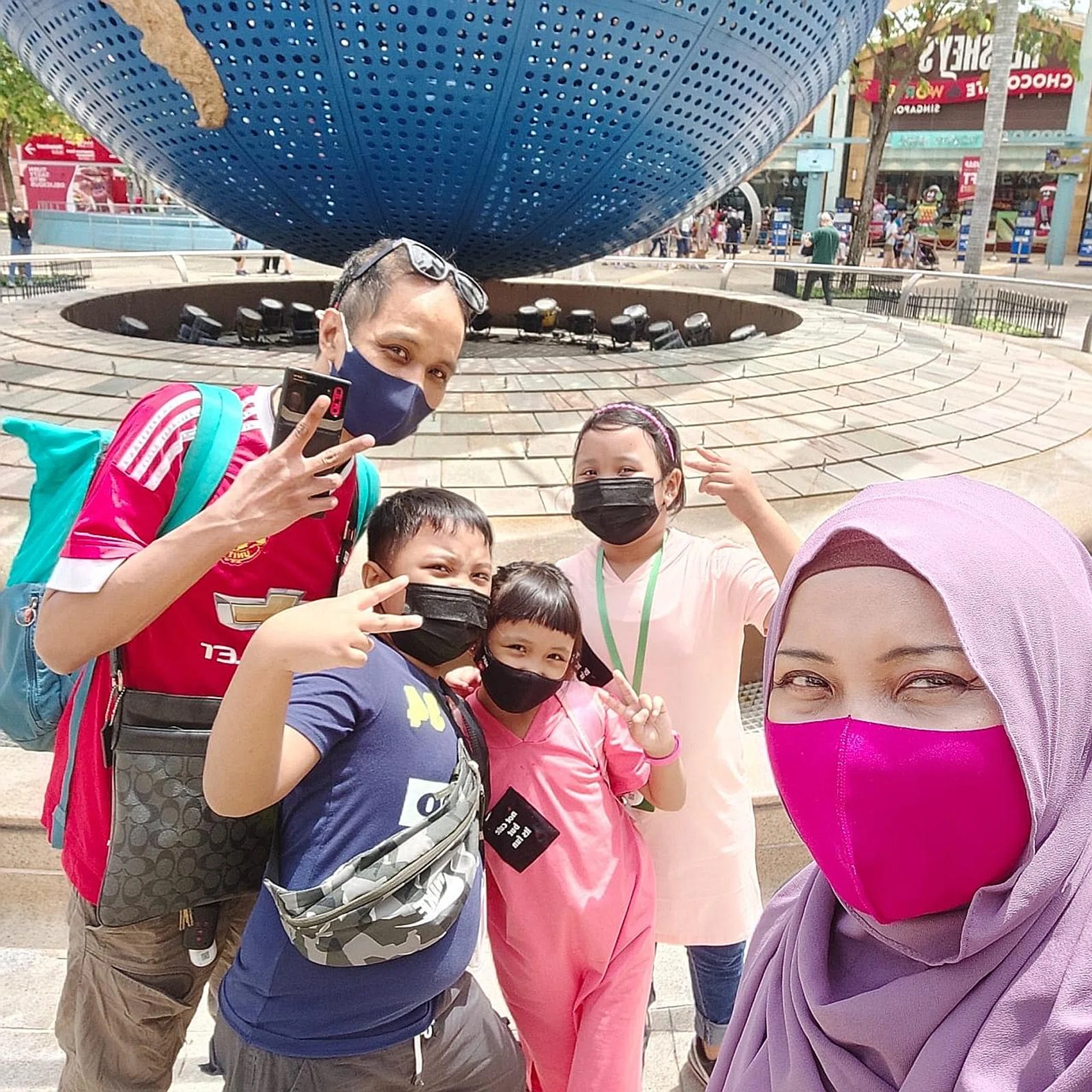 Mr Sham Laser and his family during a family outing earlier this year.