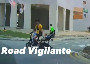 Man chided online for riding PMD while dragging baby pram in Jurong carpark