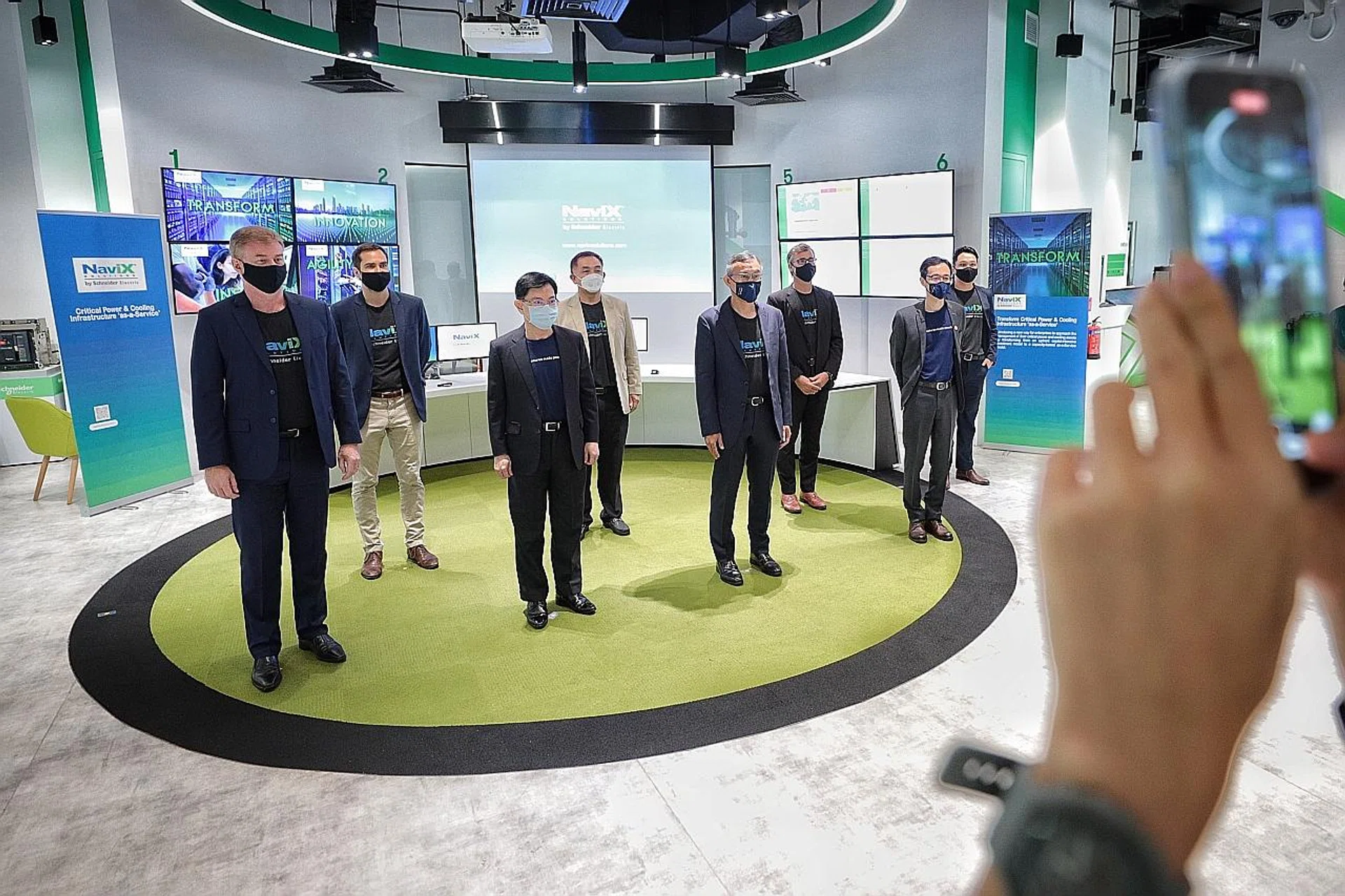 Deputy Prime Minister Heng Swee Keat (third from left) visiting Schneider Electric in Kallang yesterday. . 