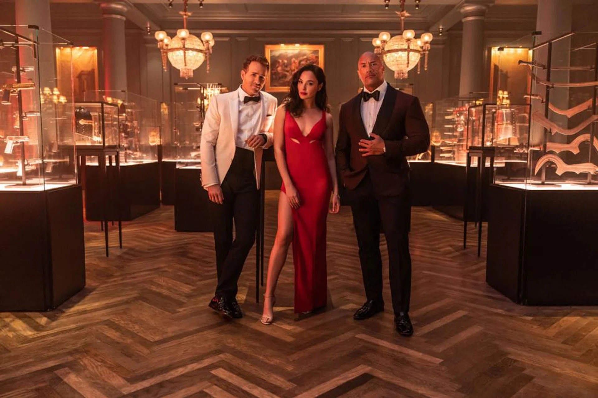 (From left) Ryan Reynolds, Gal Gadot and Dwayne Johnson lead the way in the fun albeit predictable Red Notice.