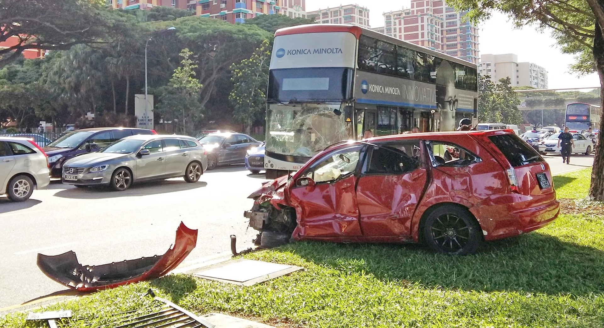 DAMAGED: (Above) The Honda, with its front bumper ripped off.
