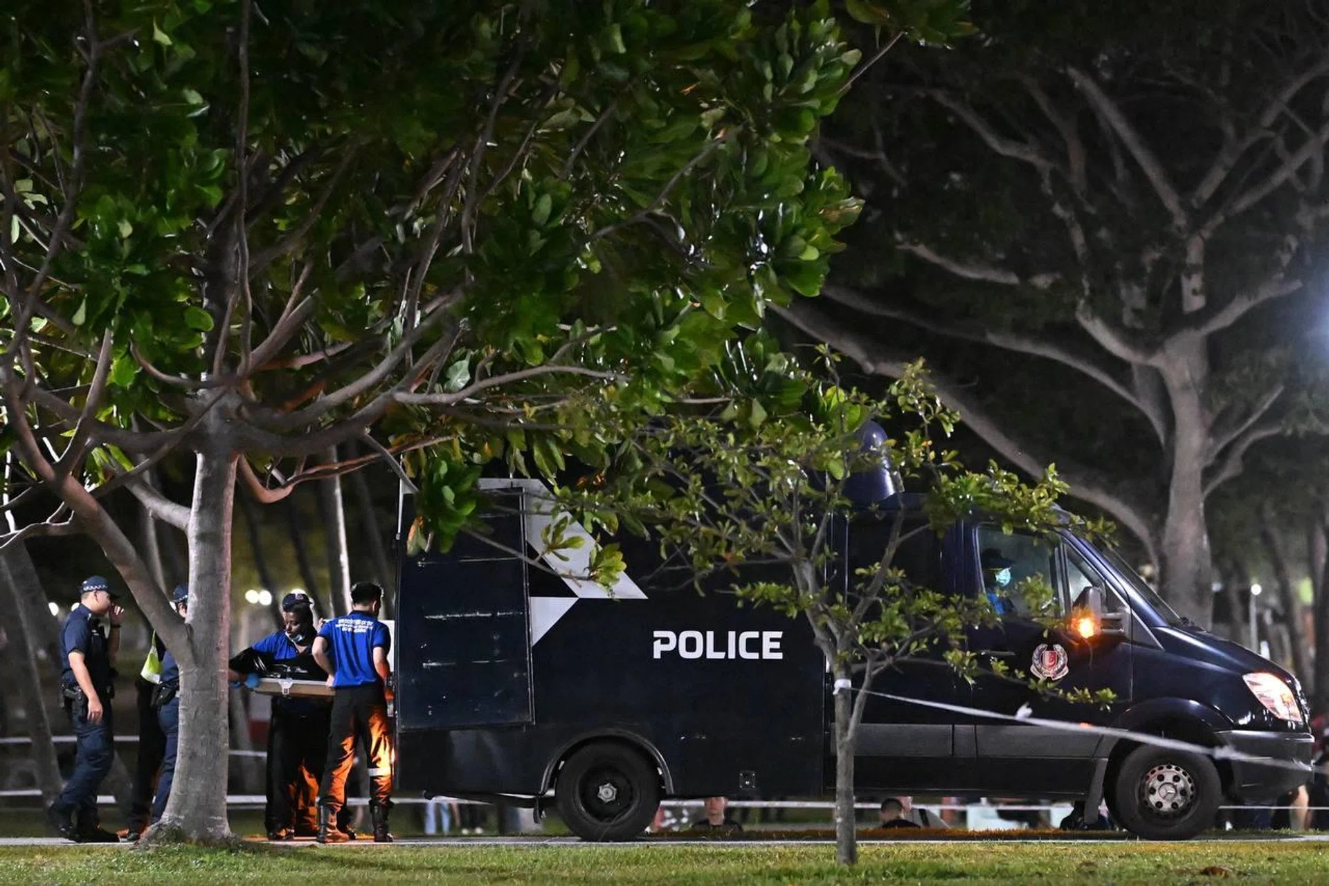 The boy's body being loaded into a police van at 12.42am on Aug 31.