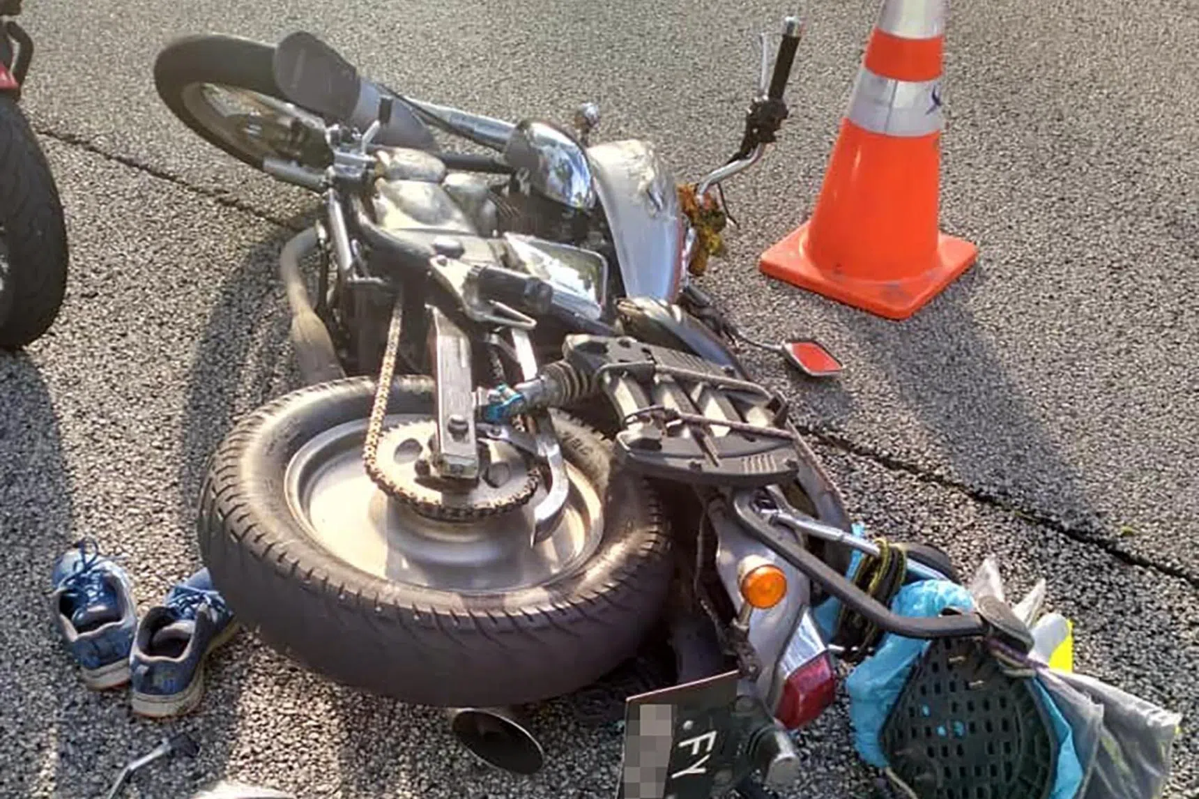 Motorcyclist, 65, taken to hospital unconscious after KJE hit-and-run