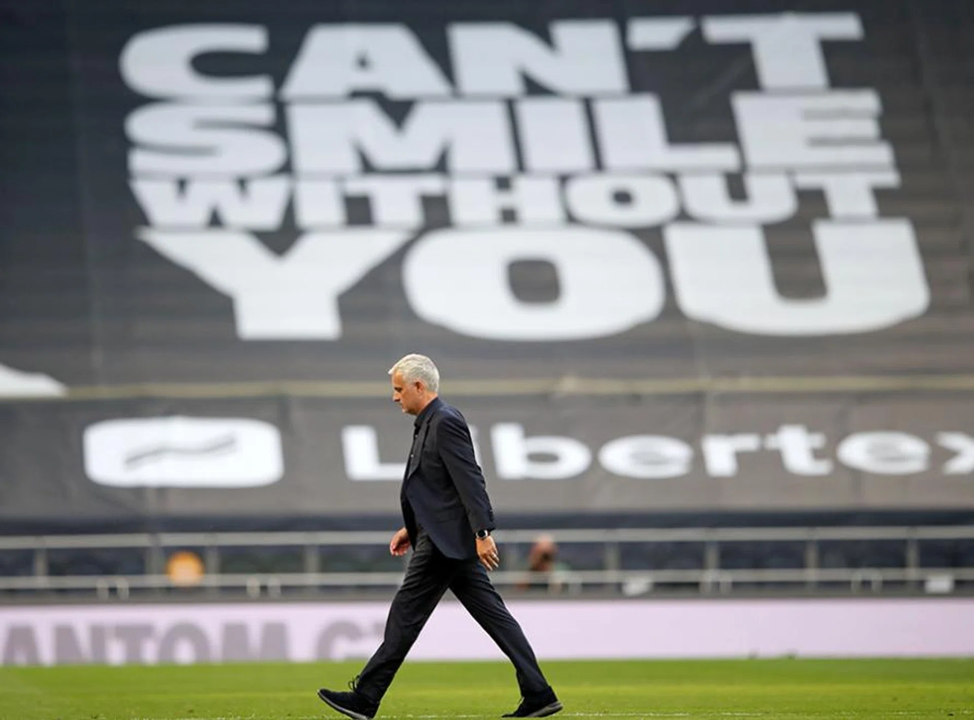 Jose Mourinho walks off the pitch at the end of the game during the English Premier League football match between Tottenham Hotspur and Everton