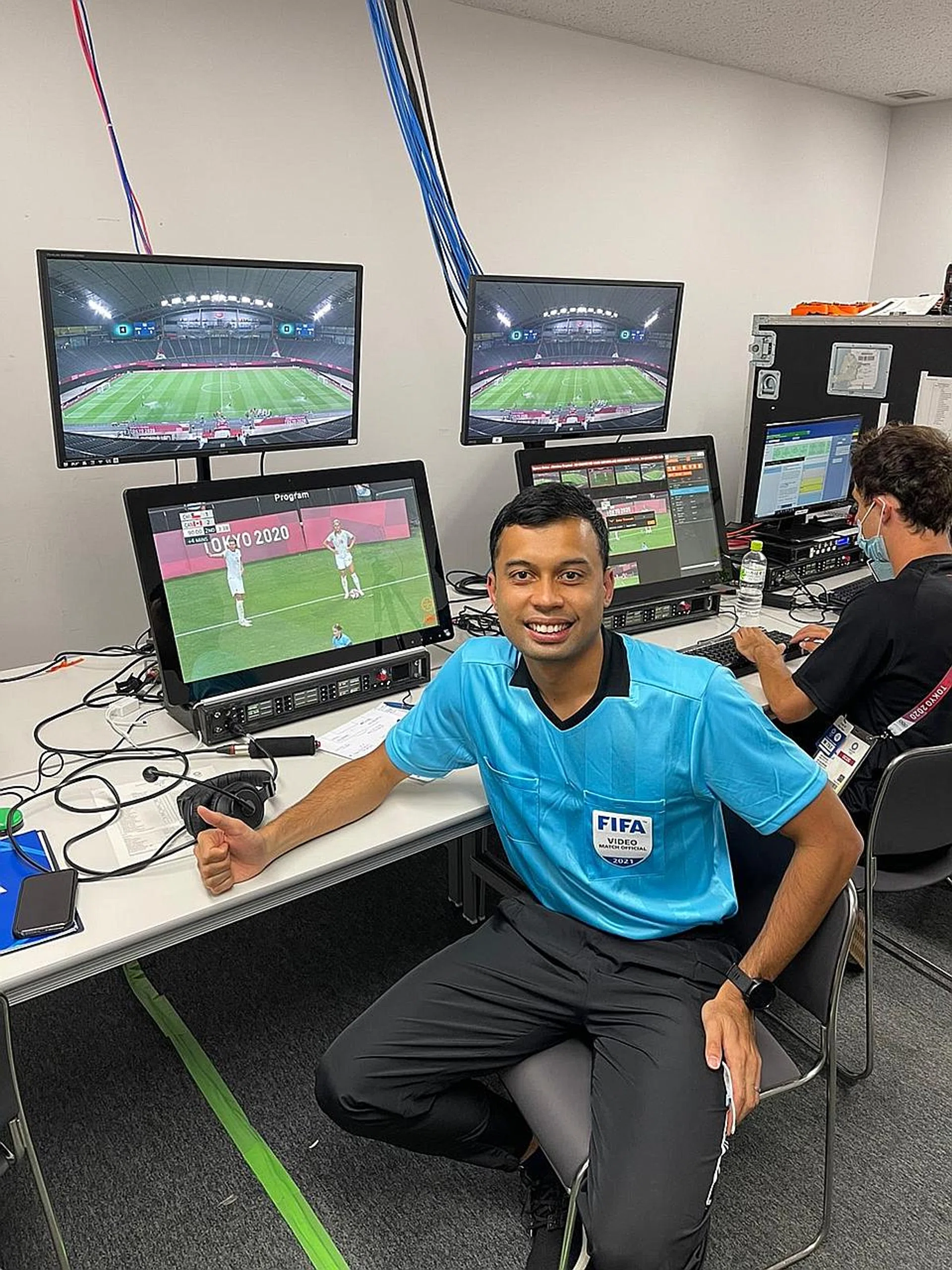 Taqi Aljaafari Jahari on duty as a video assistant referee at the Tokyo Olympics. 