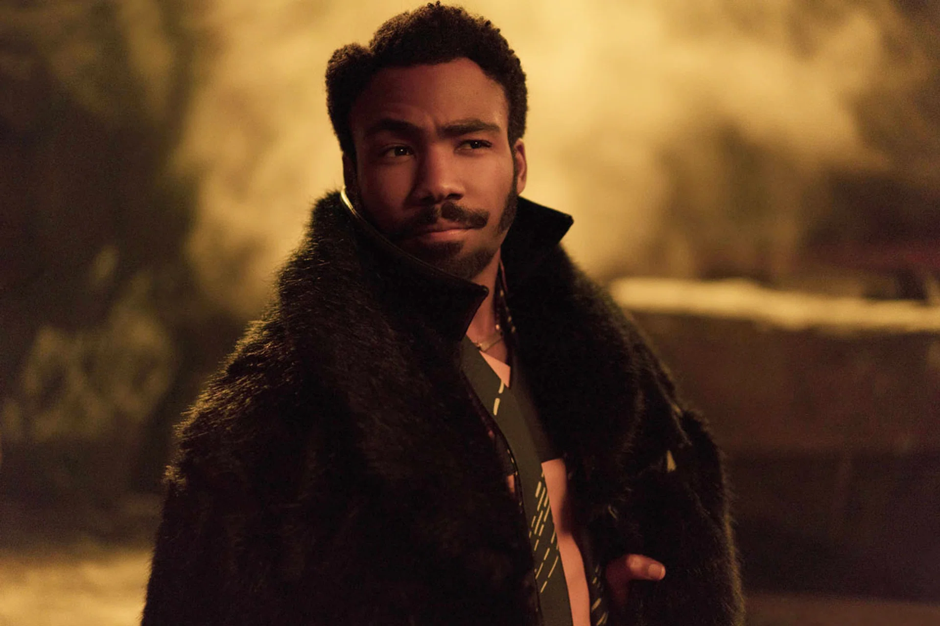 US actor-musician Donald Glover. (Right) He plays the younger Lando Calrissian in Solo: A Star Wars Story. PHOTOS: AFP, WALT DISNEY PICTURES