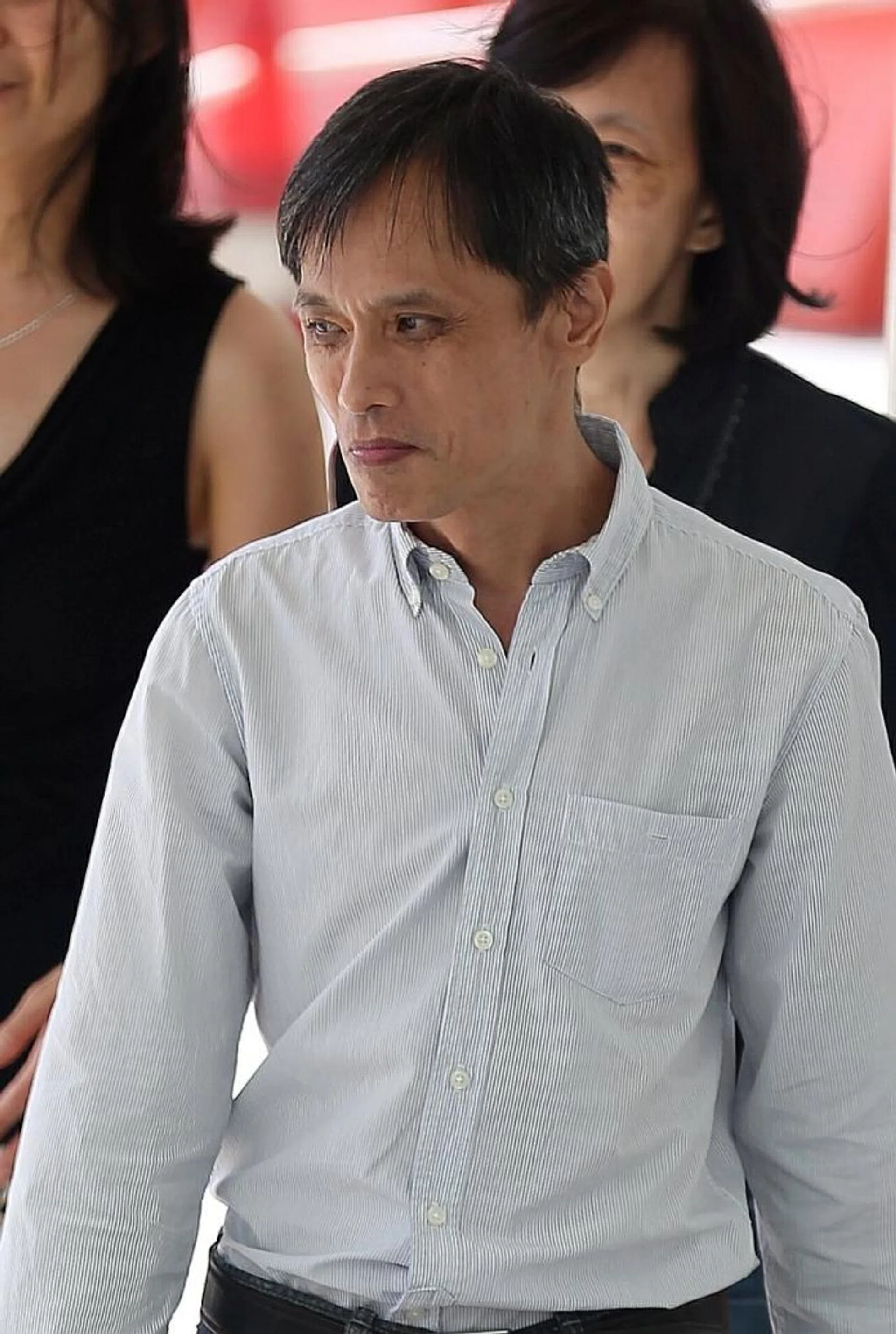 JAILED: Benjamin Chow, (above ) a married man with two sons, took upskirt videos of women at various locations in Singapore.  A Sony Ericsson K700i.