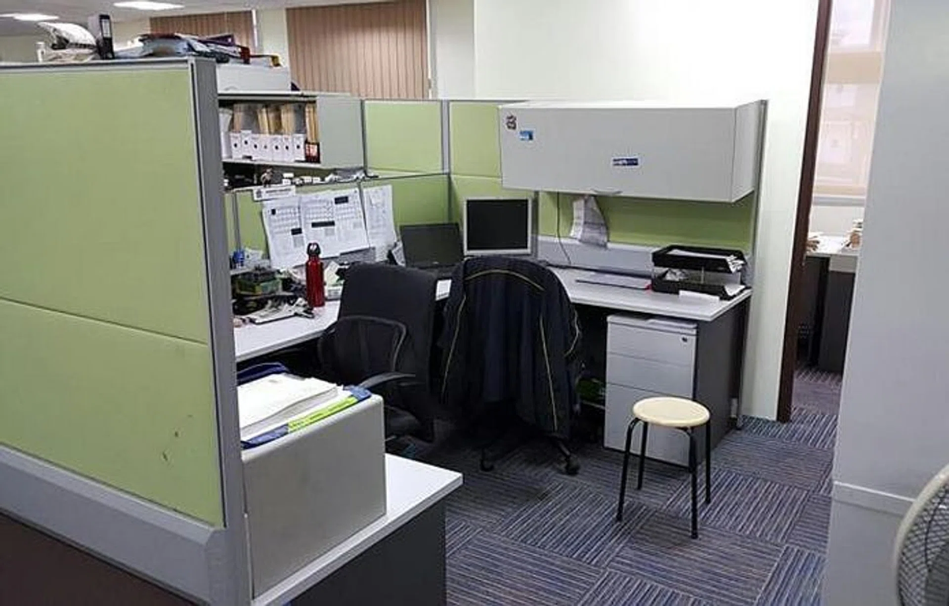 INTERVIEW: The open plan office at an Ang Mo Kio police station where an investigation officer interviewed Benjamin Lim. The officer sat at his desk (middle), while Benjamin sat on the stool. Another investigation officer, who is unrelated to the case, sat at the desk on the left.