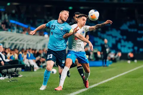 Lion City Sailors defender Diogo Costa (right) vying for the ball with Sydney FC captain Rhyan Grant.