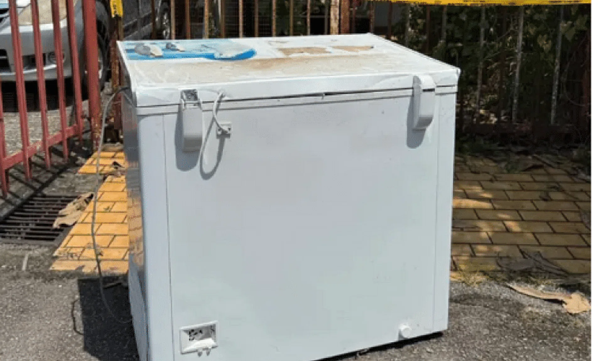 The suspect was standing next to the freezer when police arrived at the scene.