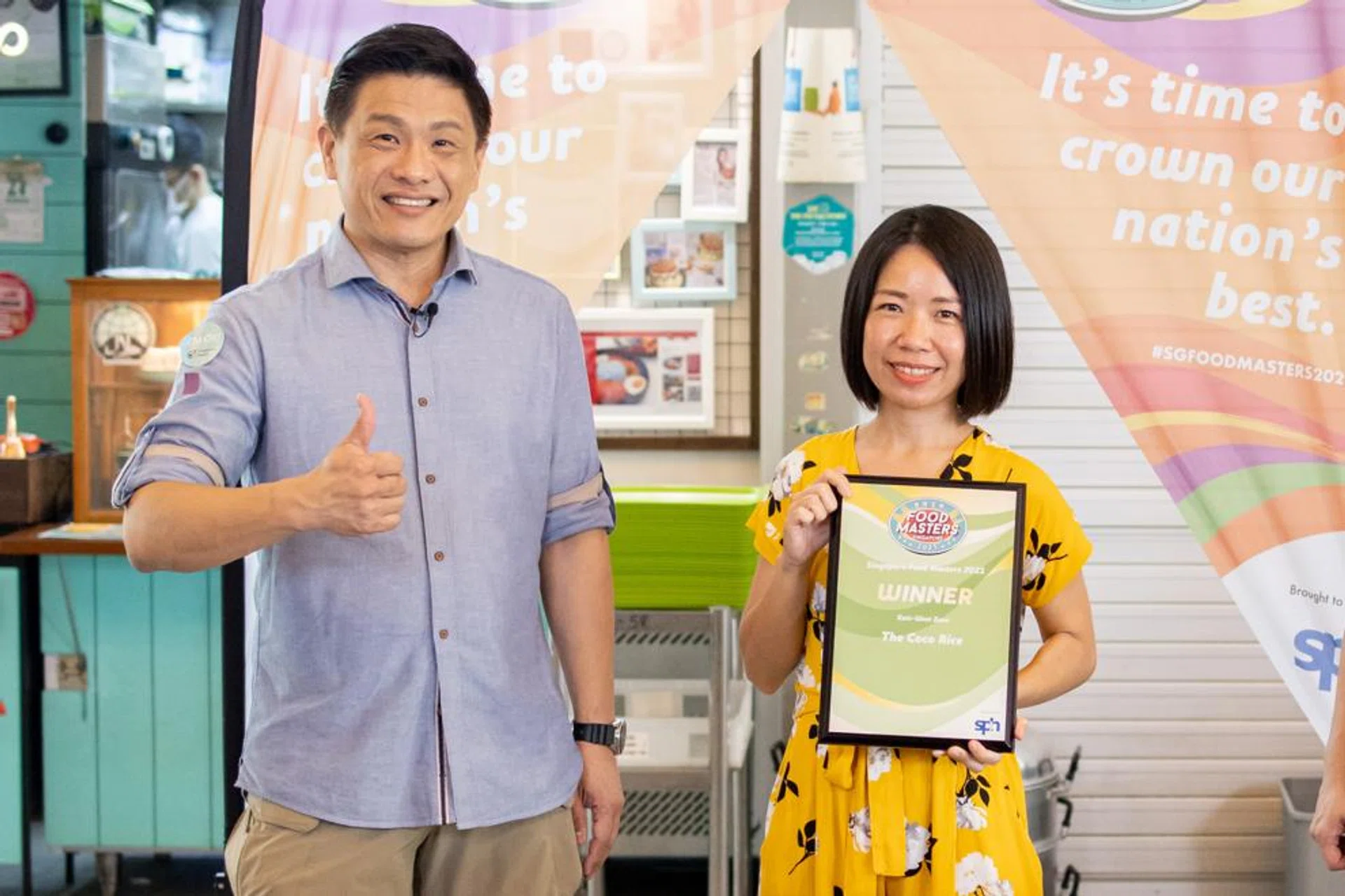 Dr Leslie Tay, host of the Singapore Food Masters 2021 Awards, and Ms Aries Chan, owner of The Coco Rice. The Tiong Bahru stall, known for its blue pea nasi lemak, was one of three winners in the (East-West) zone. 