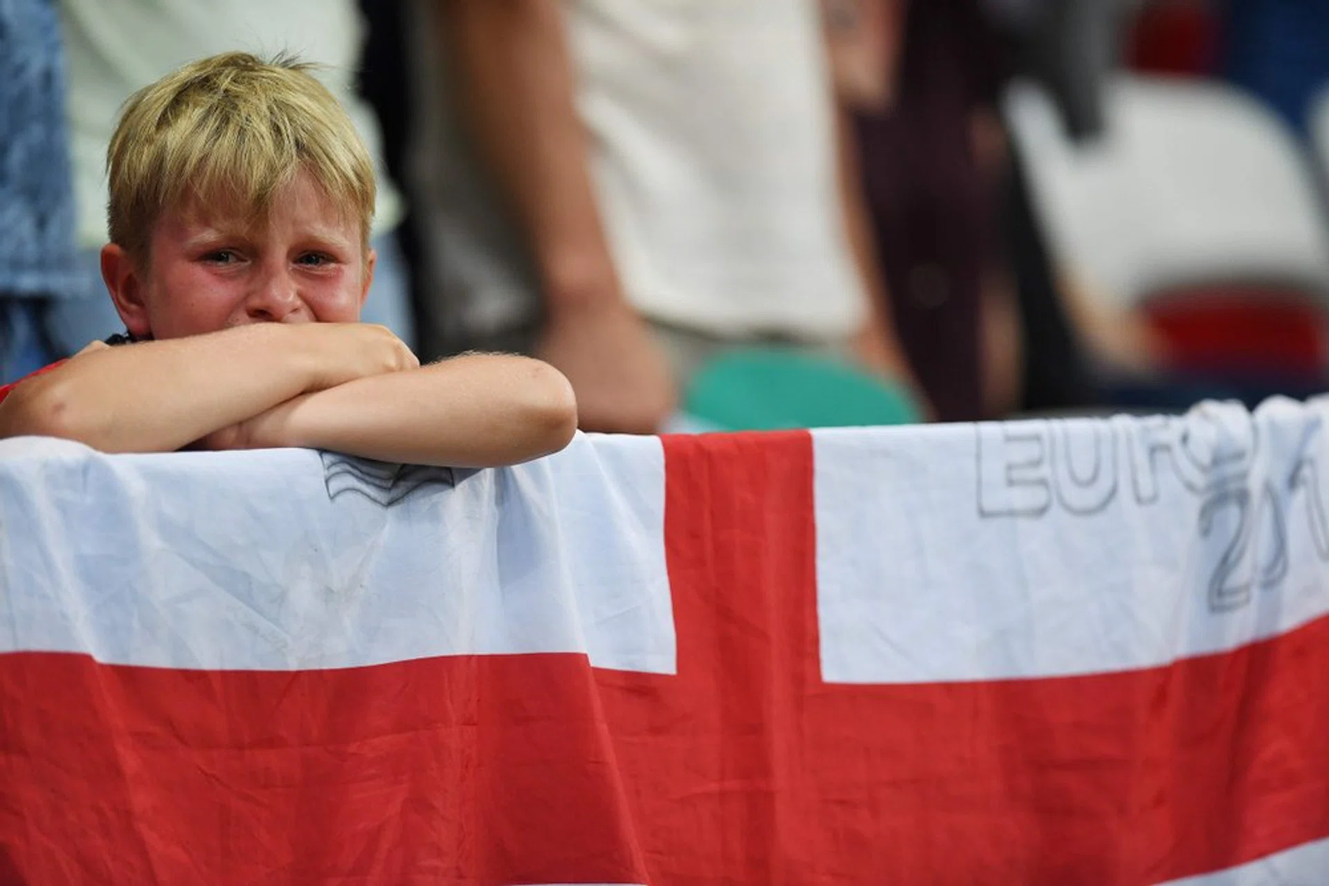  A young England fan reacts during after England lost 1-2 to Iceland in the Euro 2016.