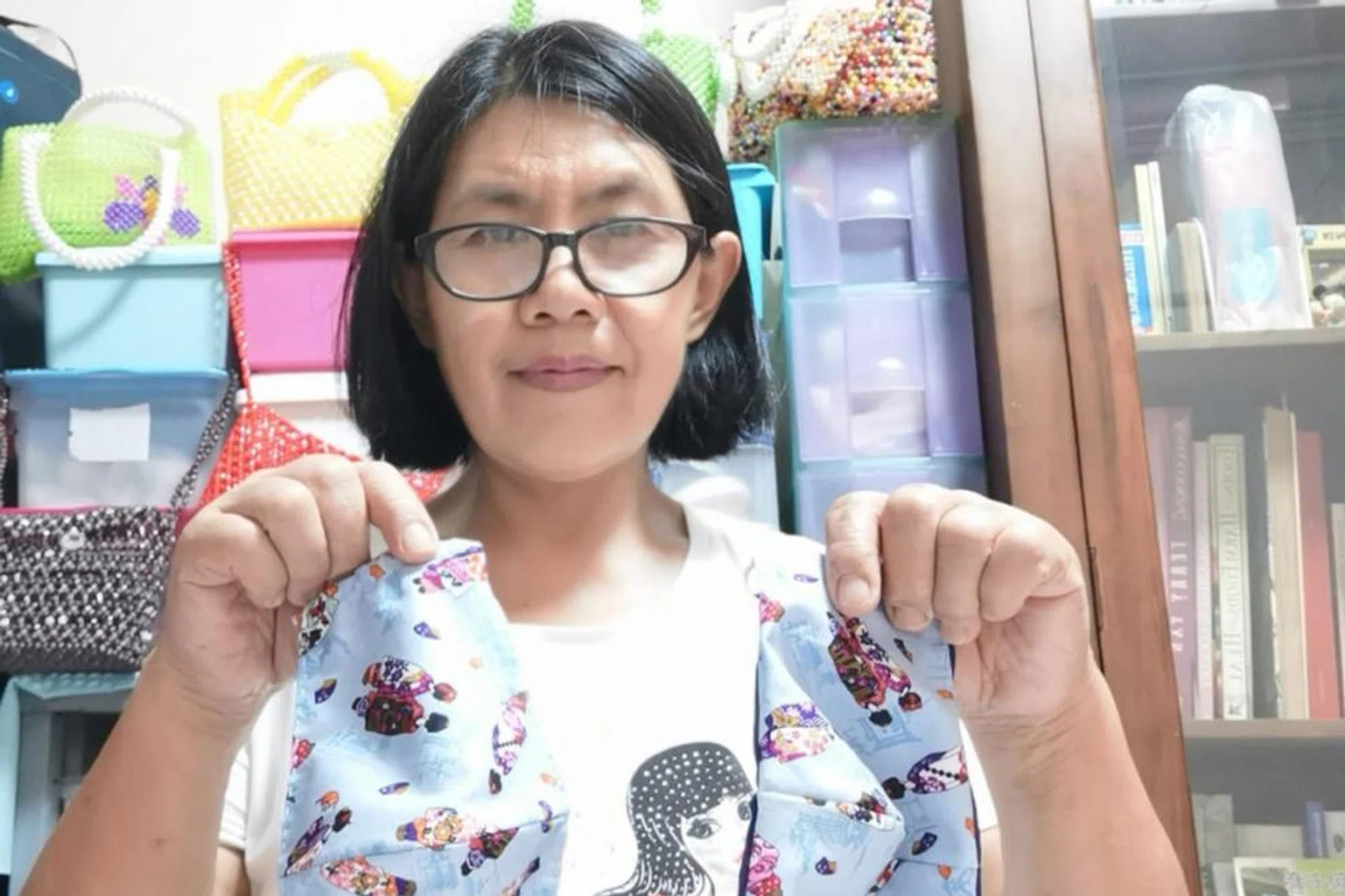 Filipino helpers Milagros Bangkiat (above) and Rhealyn Nudalo who sewed masks for their employers. 
