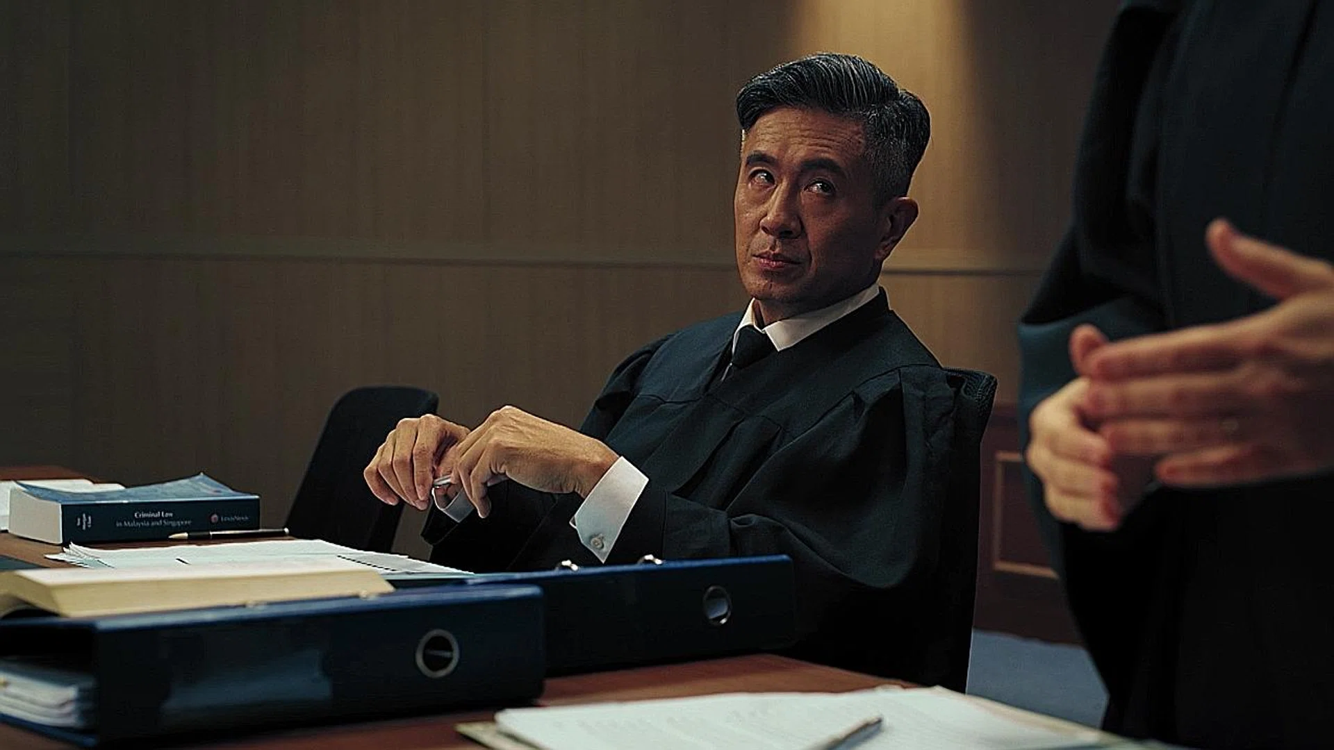 (Above) Adrian Pang reprises his character in The Pupil, lawyer Dennis Tang, in the show.  
