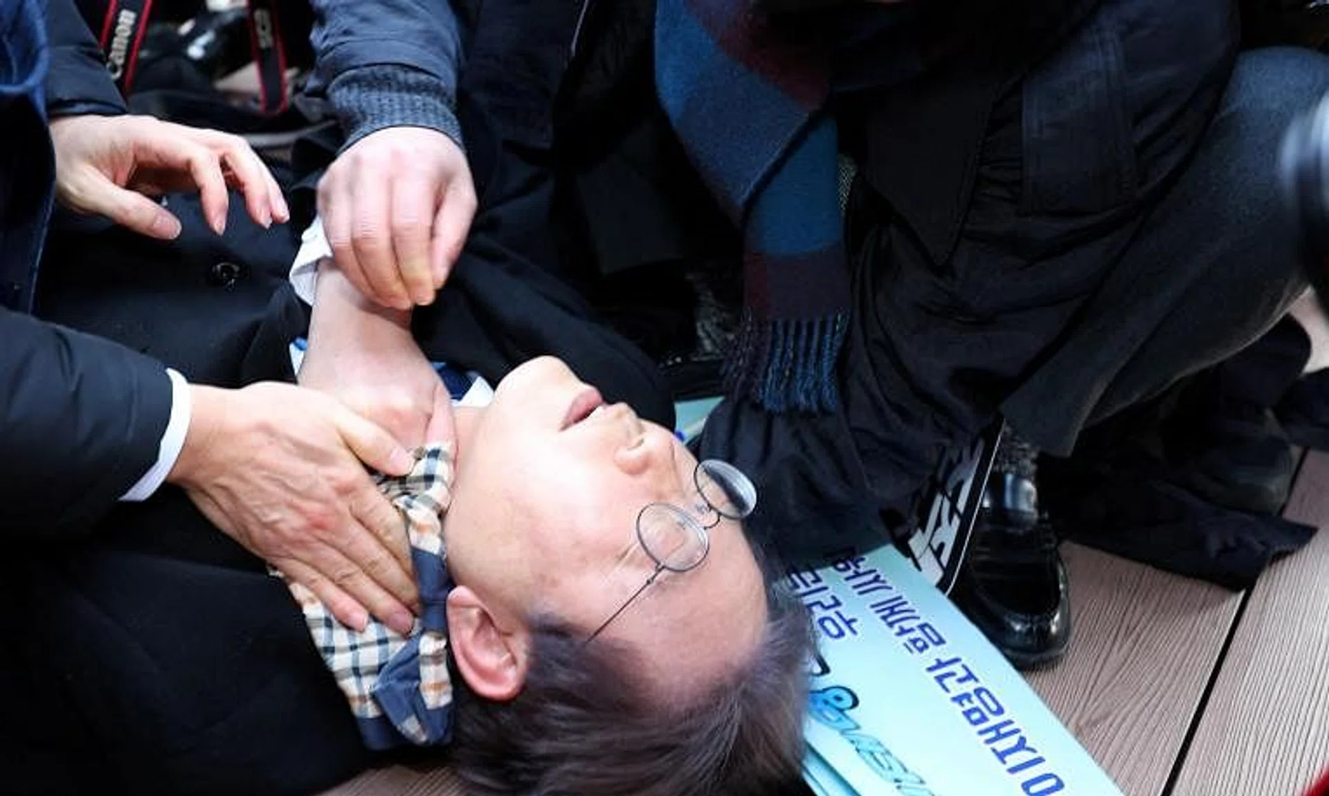 South Korea’s opposition party leader Lee Jae-myung falling after being attacked by an unidentified man during his visit to Busan, South Korea.
