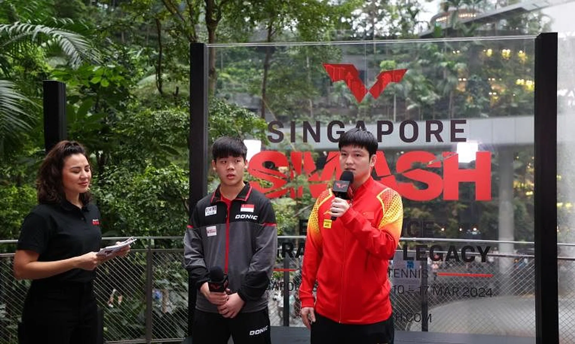 China’s Fan Zhendong (right) and Singapore’s Izaac Quek at the World Table Tennis Singapore Smash draw ceremony at Jewel Changi Airport.