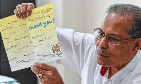 Retired cop in Malaysia reconnects with drowning boy he saved 19 years ago