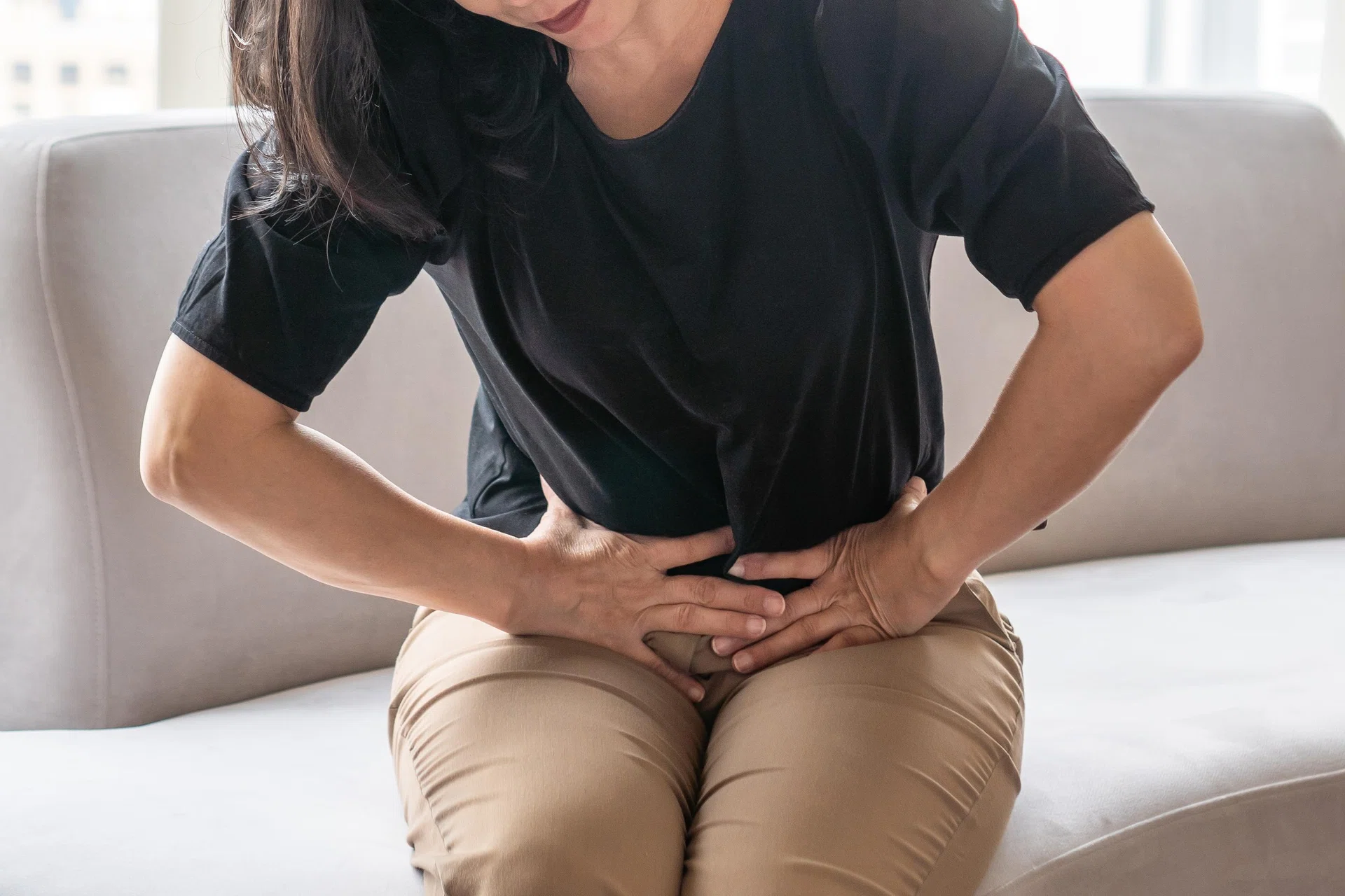 The woman experienced abdominal pain after taking abortion pills.