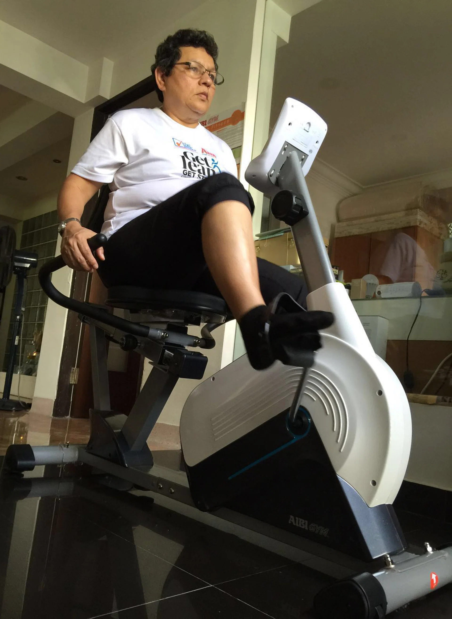 GET FIT: AIBI lent Miss Junita Rodrigues, 56, a recumbent bicycle to use at home.