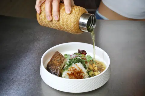 To:You's ochazuke with grilled salmon, tamago, torched short-grain rice and matcha dashi.