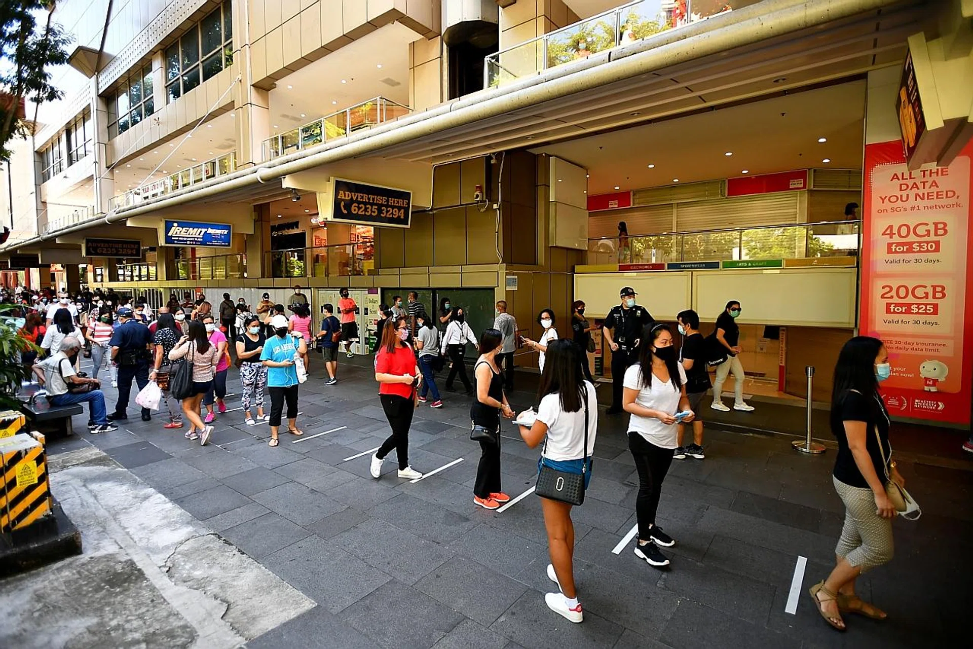 MOM said while foreign domestic workers can spend their rest day outside, they should not gather in groups of more than five or visit crowded places such as Lucky Plaza (above). TNP FILE PHOTO