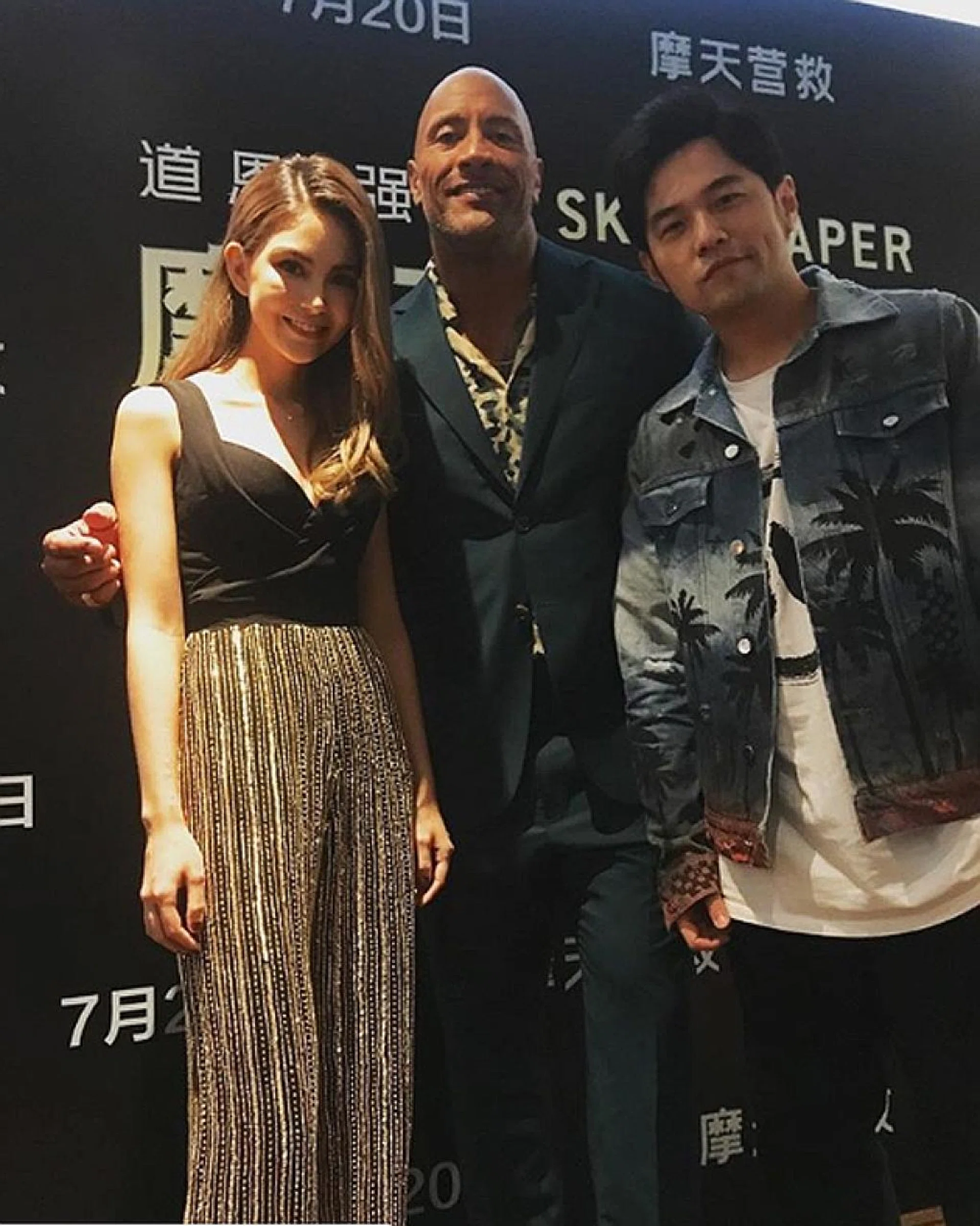 Hannah Quinlivan at the Hong Kong press conference, in Skyscraper and (above)with co-star Dwayne Johnson and husband Jay Chou. 