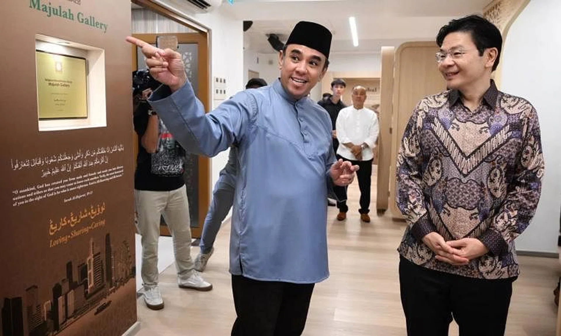 DPM Lawrence Wong (right) touring the Majulah Gallery at Khadijah Mosque with the mosque's chairman and Religious Rehabilitation Group co-chairman Mohamed Ali on April 1.