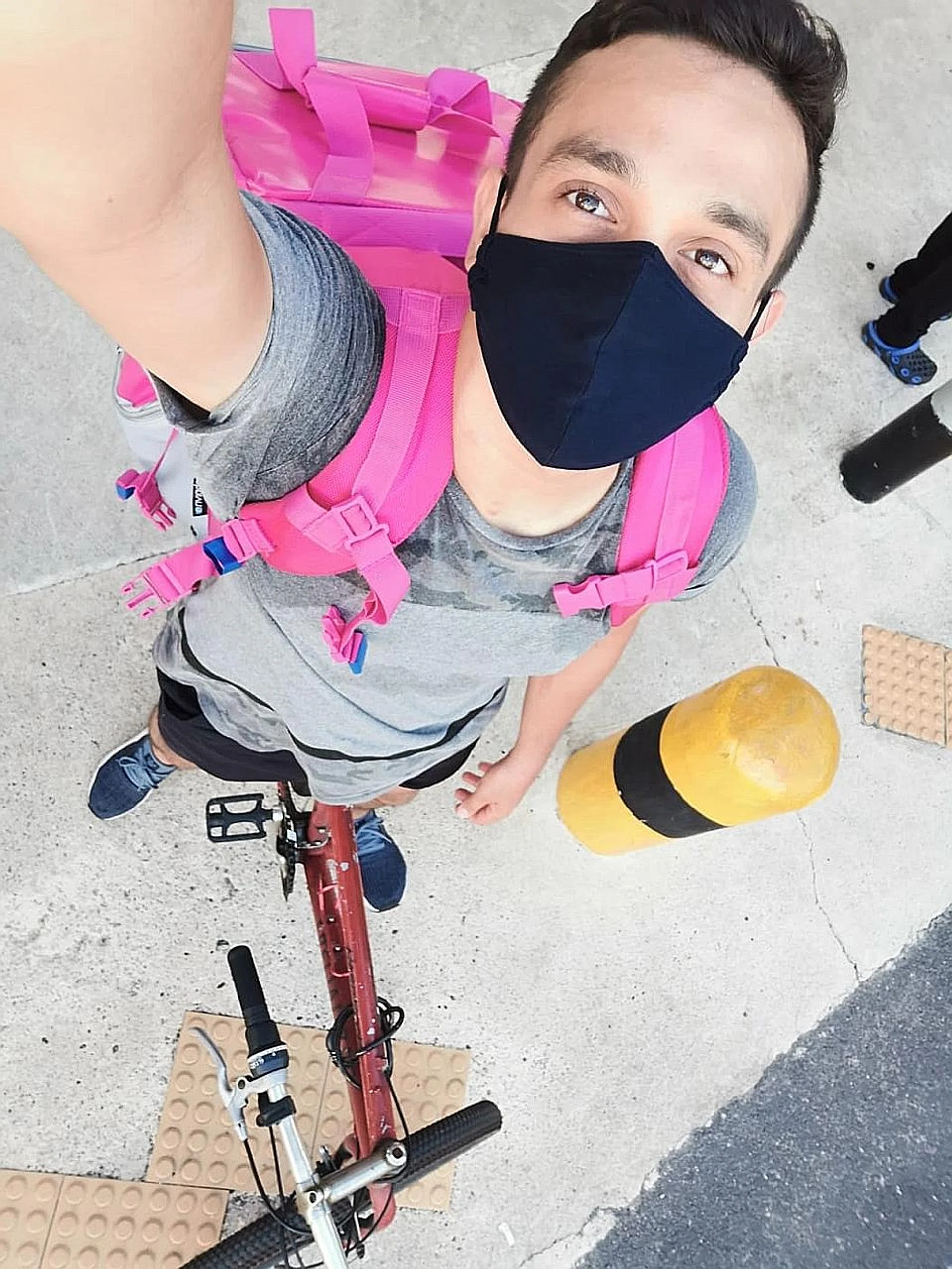 Erwin Dawson on the job as a Foodpanda delivery rider.  