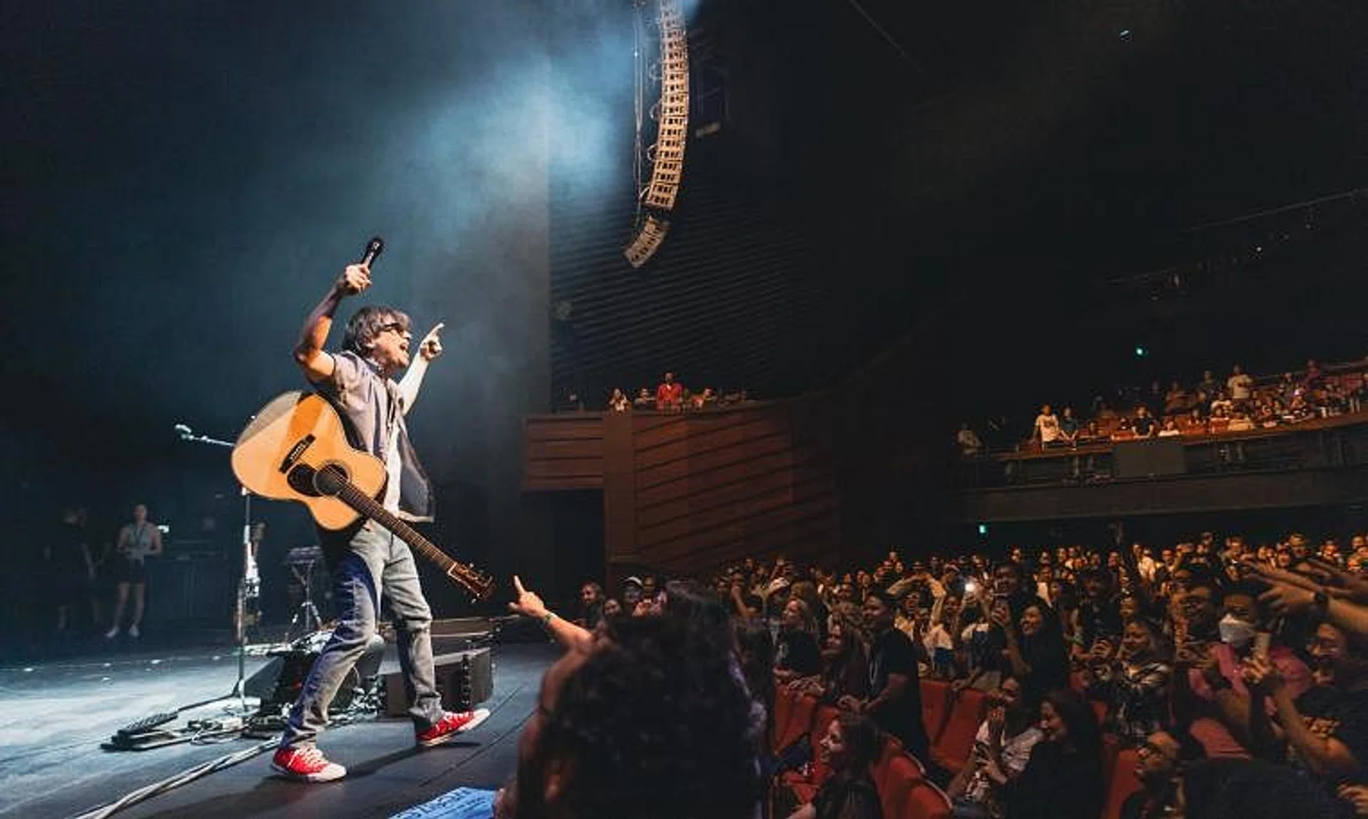 Rivers Cuomo, singer of rock band Weezer, endeared himself to the local audience at their Singapore concert.