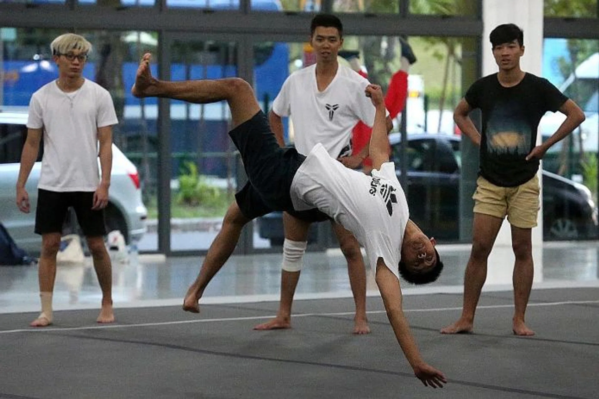 FUN: Mr Dylan Lim (in black) doing 'tricking' with his friends. 