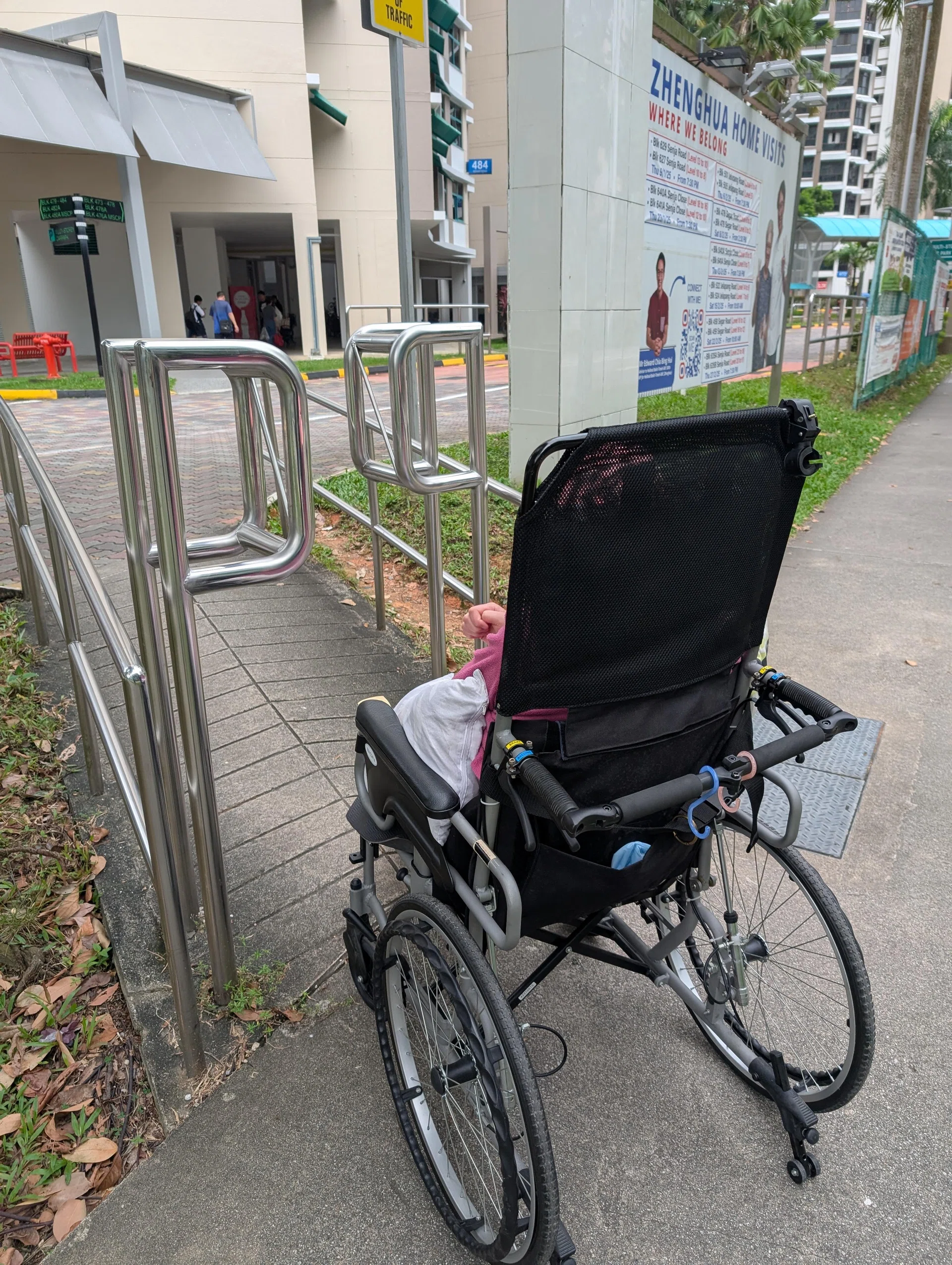 Why is there a railing on a ramp that inconveniences disabled people?