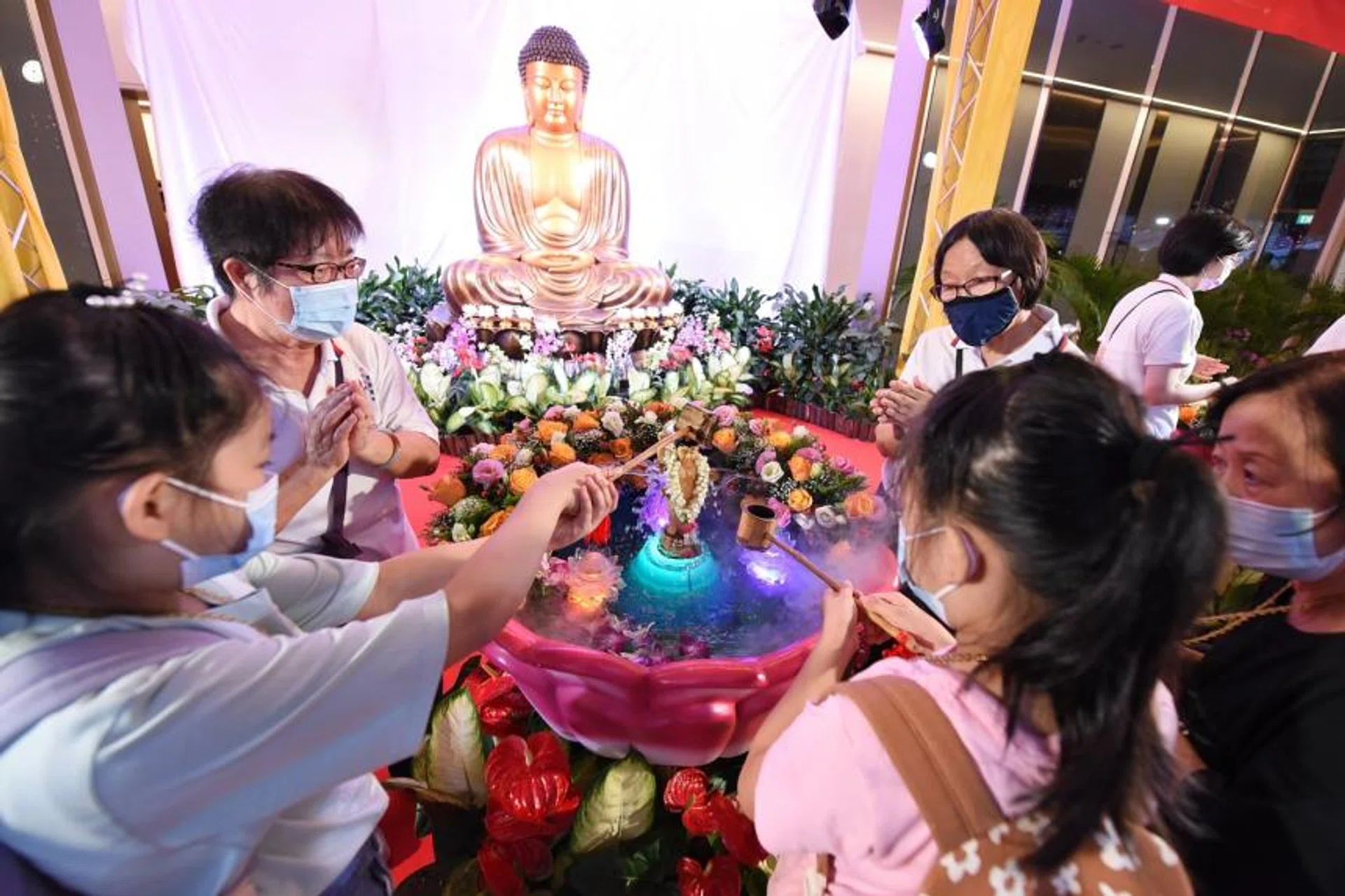 Devotees gather at Kong Meng San Phor Kark See Monastery on May 14 for the bathing of Prince Siddhartha.
