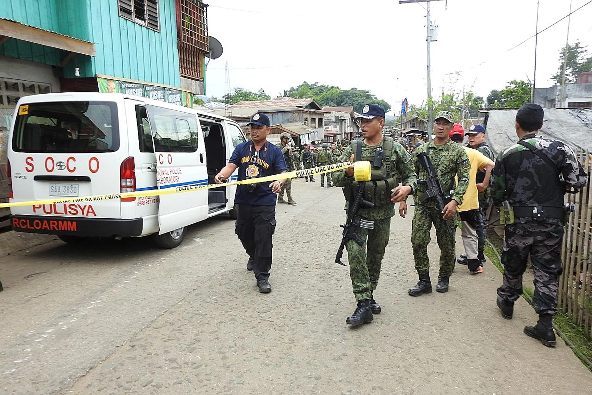 Officials cordoning off an area after a blast in Sulu, the Philippines. 