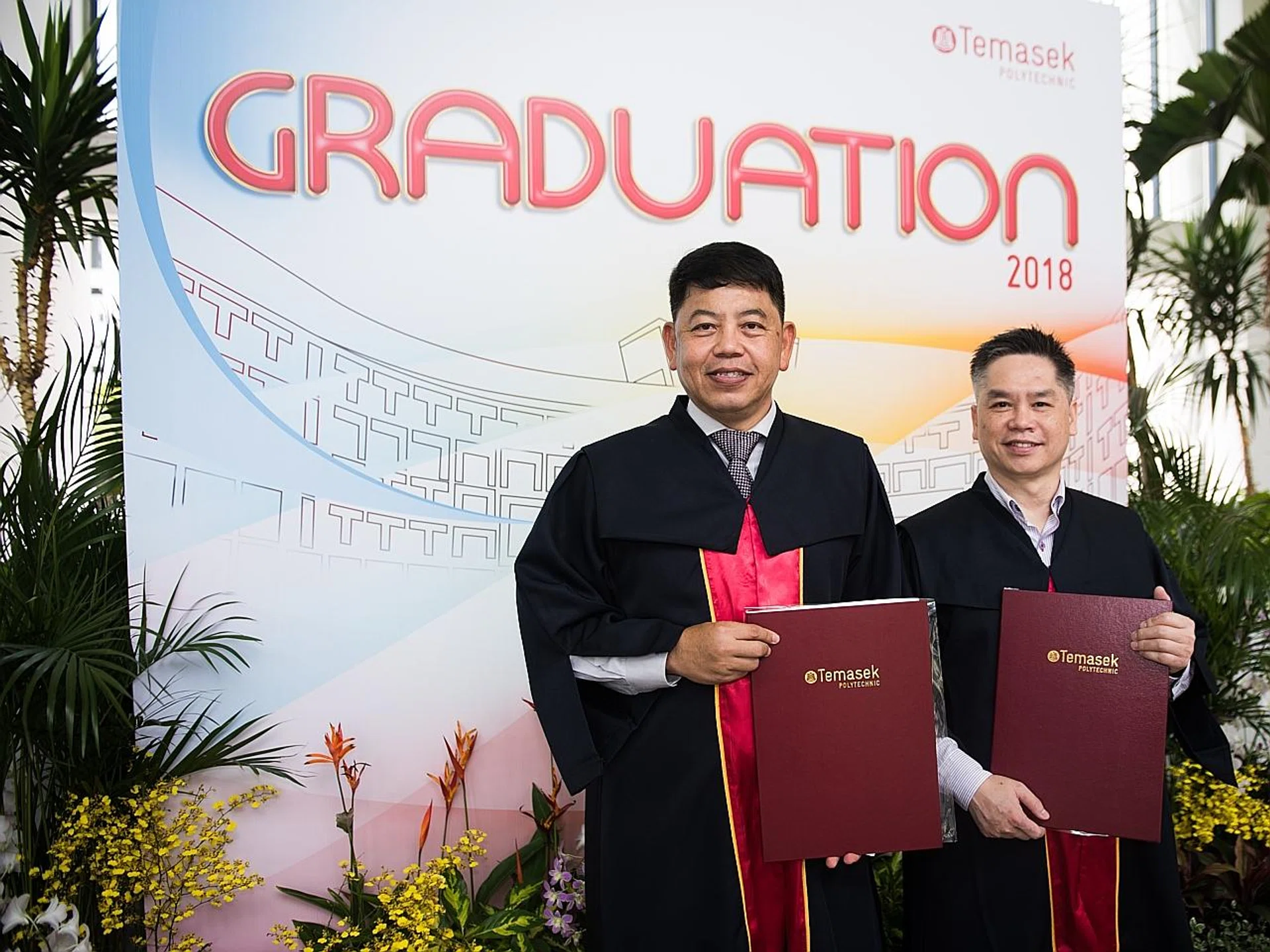 (From left) Mr Tan Wee Teck and Mr Chan Chew Seng are both 56. They graduated from Temasek Polytechnic yesterday. 