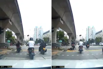 Man falls off motorcycle as it moves off outside Bukit Panjang Plaza