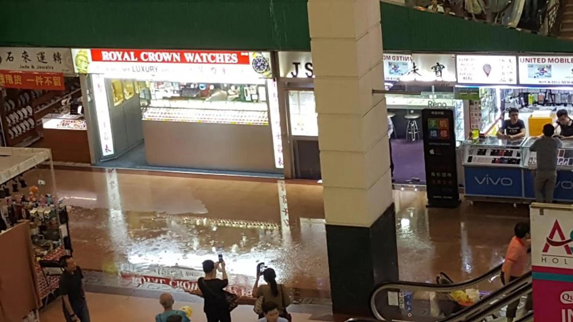 An afternoon downpour flooded shops in People's Park Complex in Chinatown yesterday. Shopkeepers said rainwater started flooding the carpark at about 1.20pm, before entering the first three storeys of the complex. Ms Emerald Tang, 33, said many of her perfume products, including luxury brands such as Chanel and Dior, were damaged. 