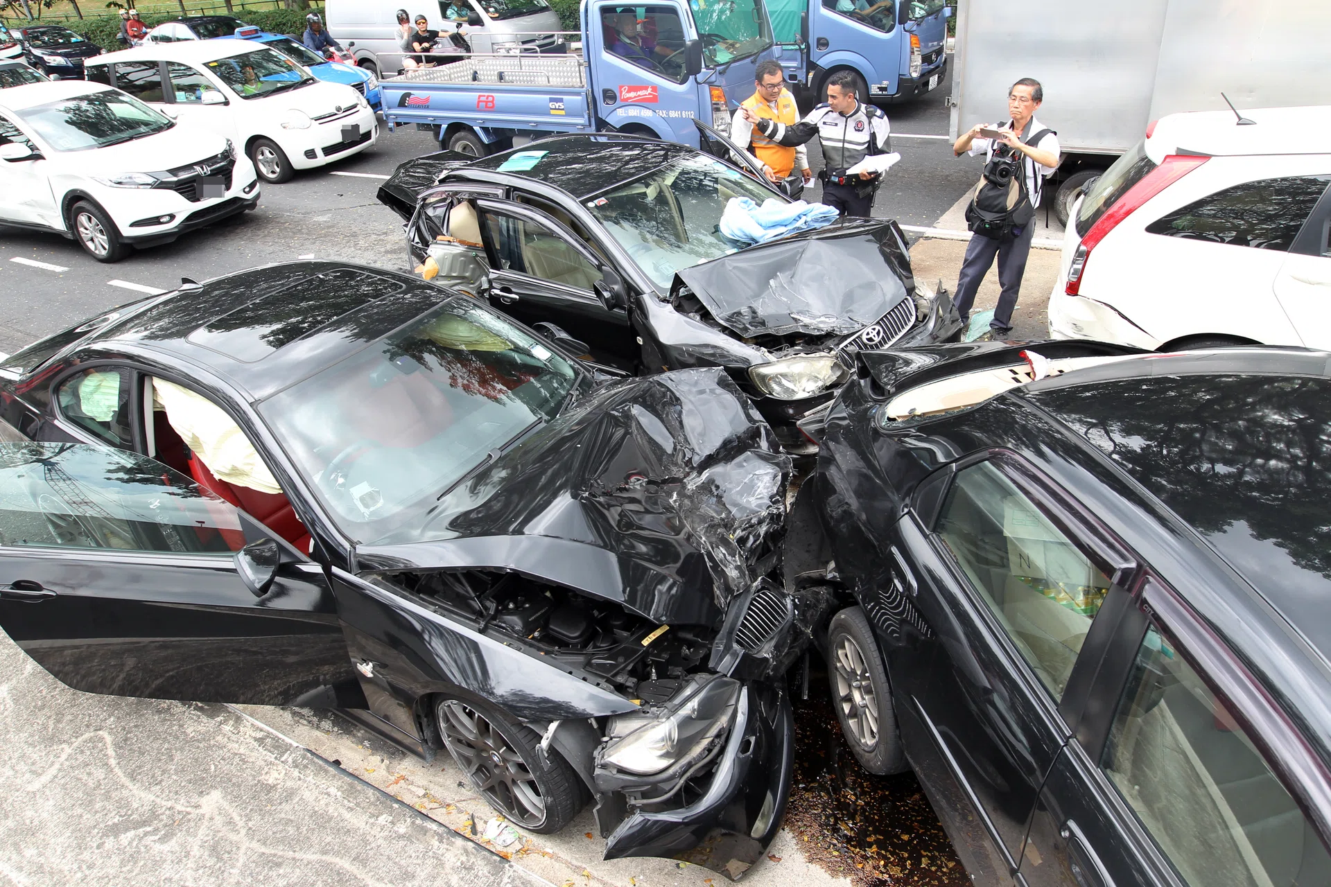 DESTROYED: Two were taken to the hospital in the six-car accident in Yishun. 