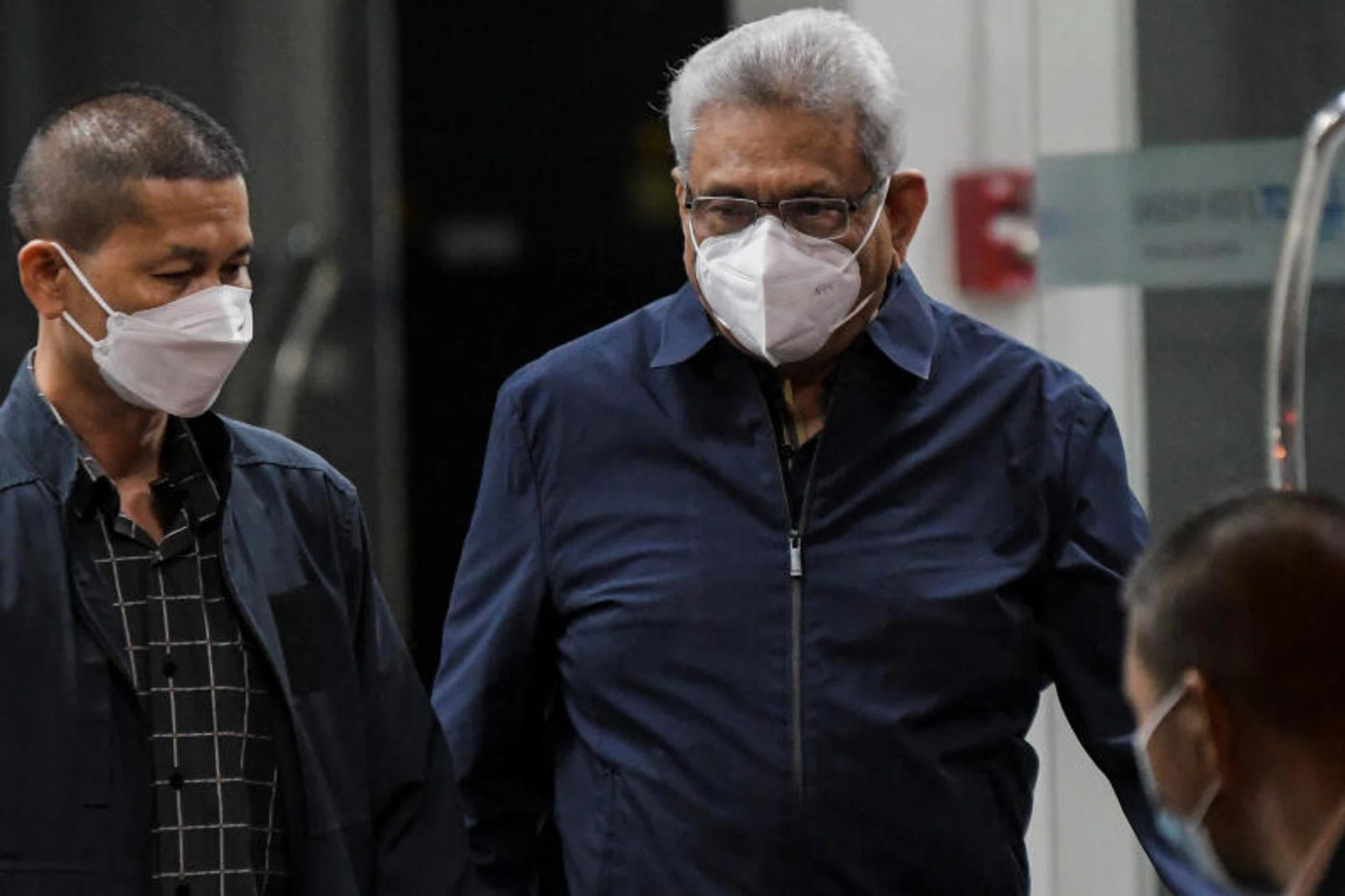Former Sri Lankan president Gotabaya Rajapaksa (right) arriving at Bangkok's Don Mueang airport on Aug 11, 2022. 