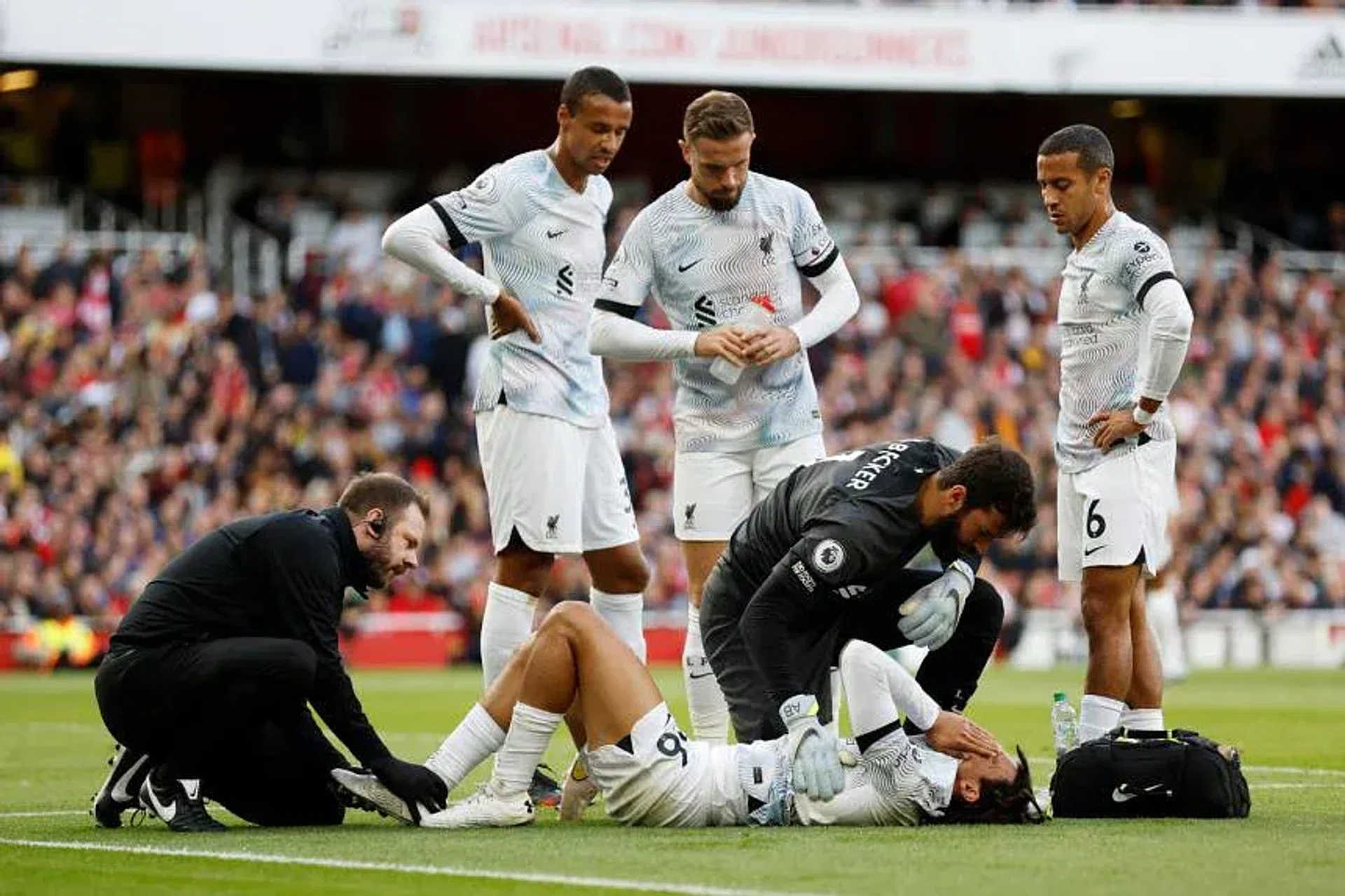 Liverpool's Trent Alexander-Arnold receives medical attention after sustaining an injury. 