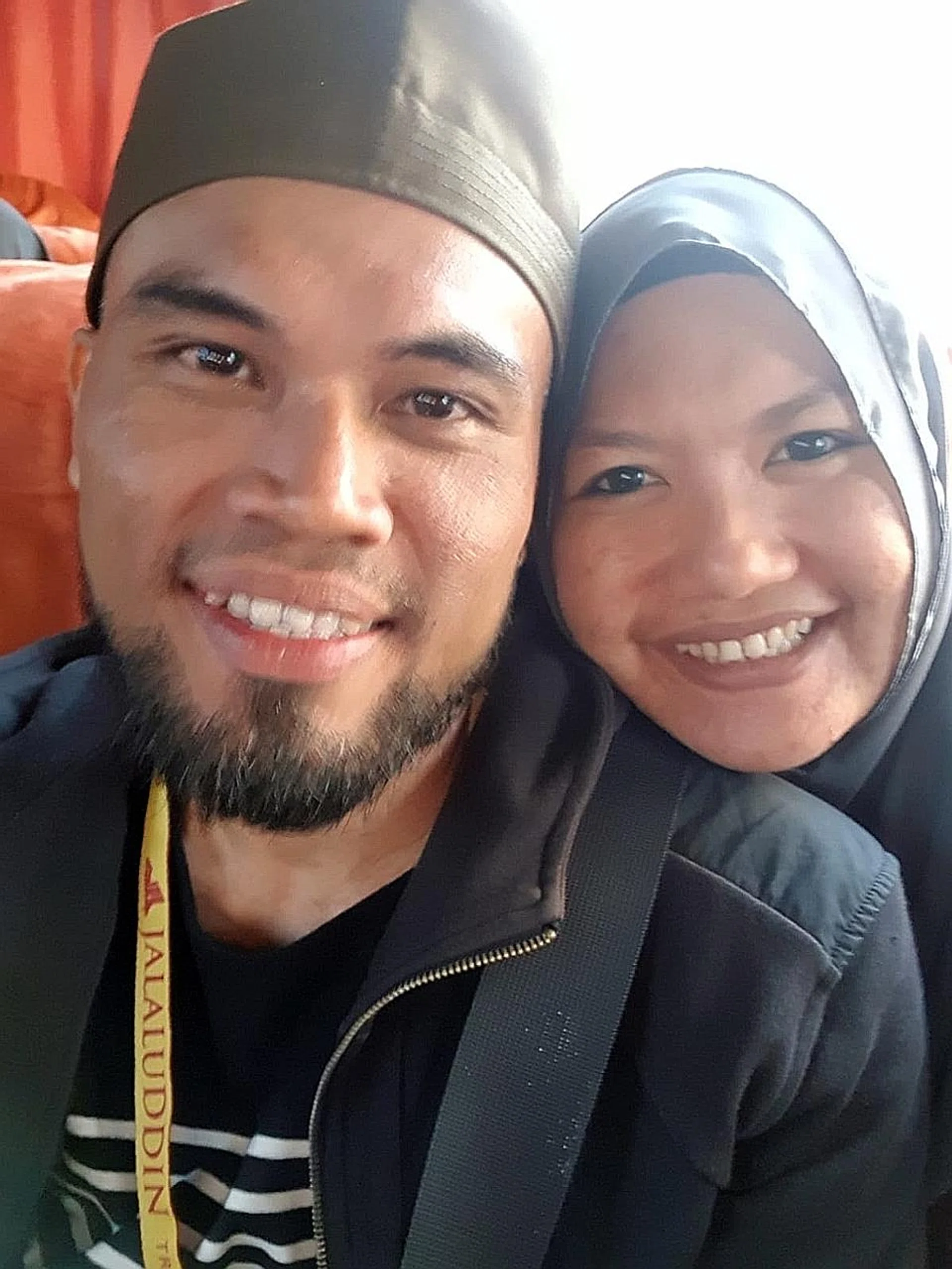 Mr Indra Shaiful with his wife Salinah Mohamed in a family photo. 
